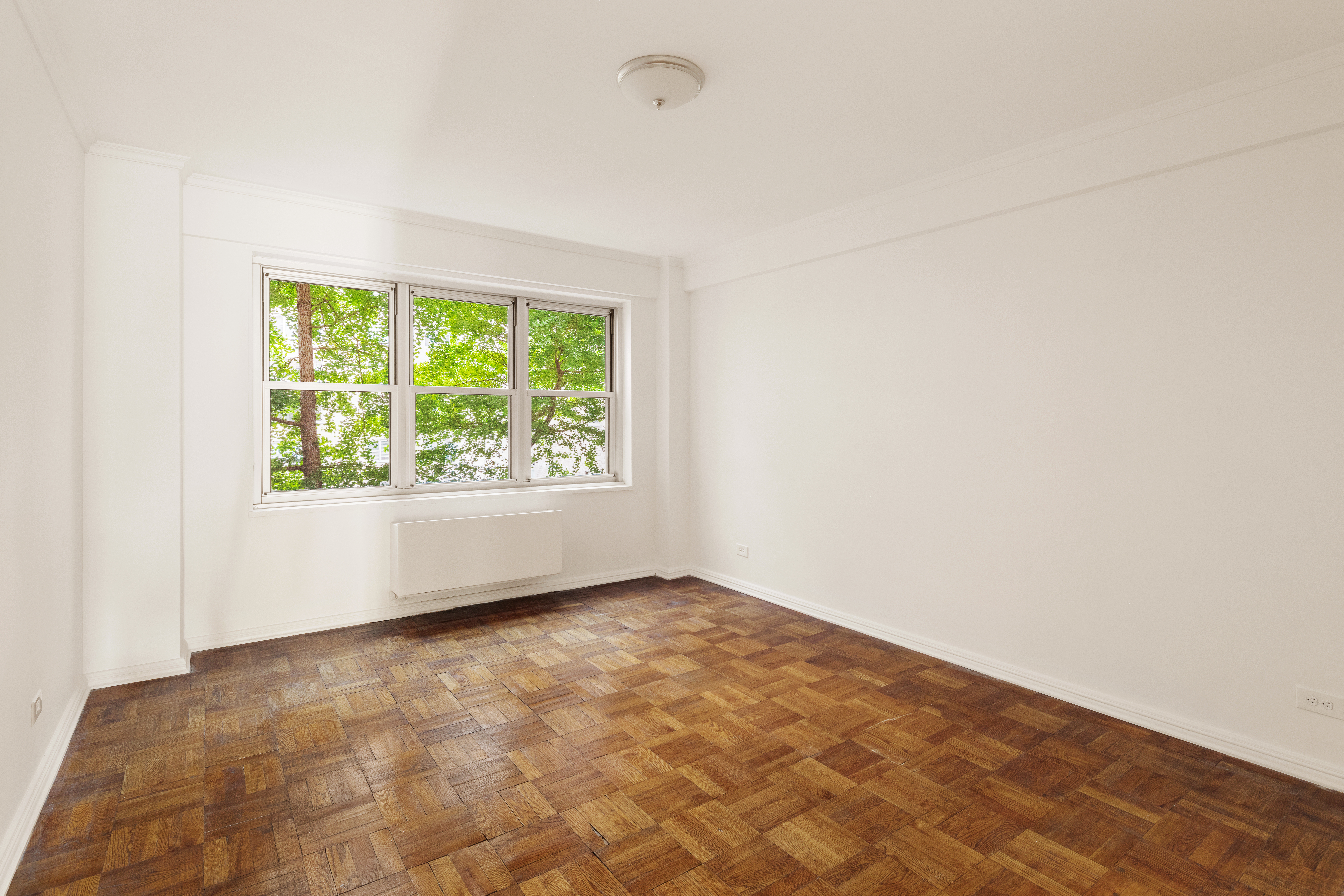 11 5th Avenue, Unit 5LW Manhattan, NY 10003 - Photo 14 of 19 an empty room with a window