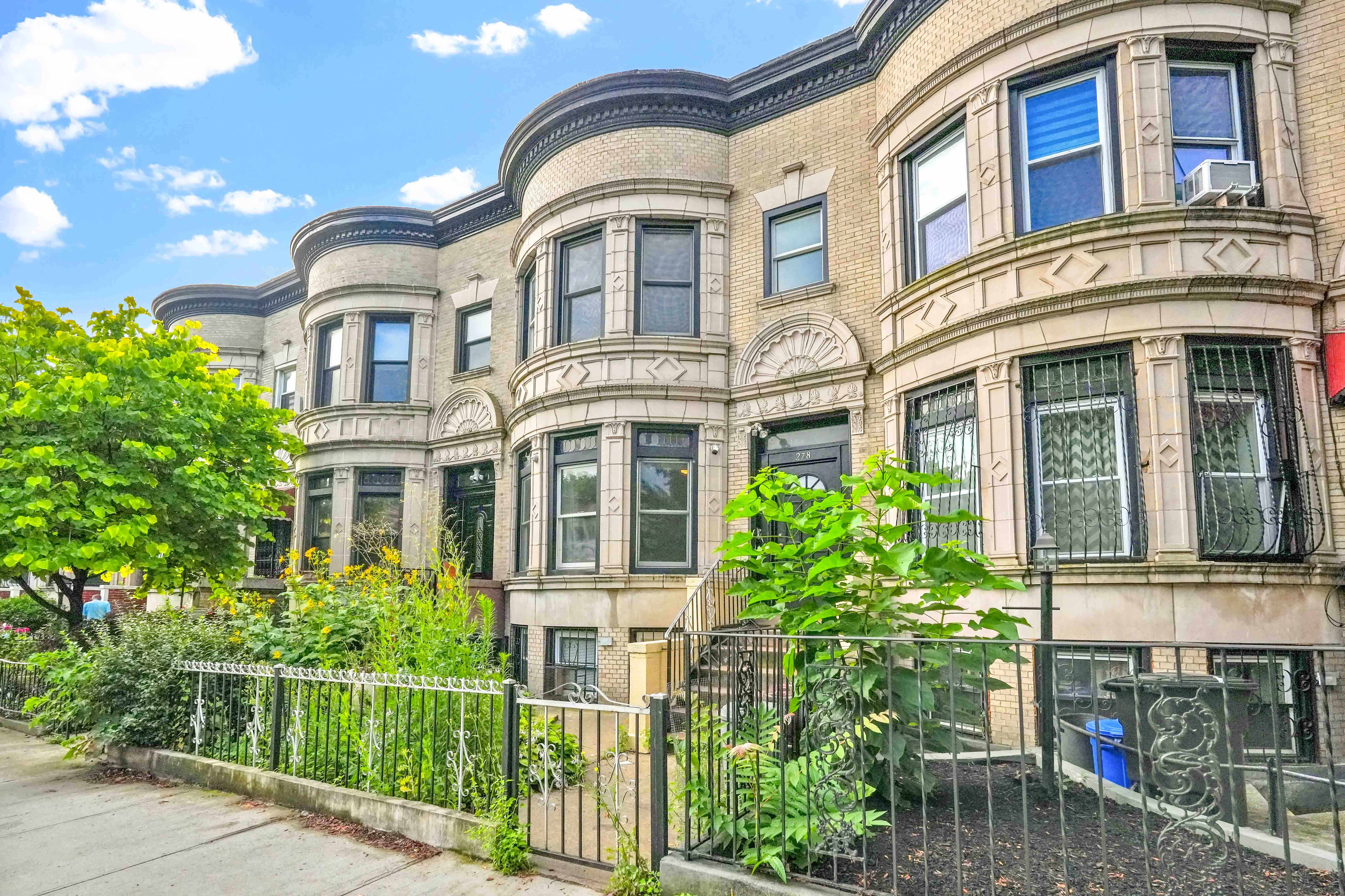 278 Lefferts Avenue Brooklyn, NY 11225 - Photo 3 of 56 front view of a brick house with a large windows