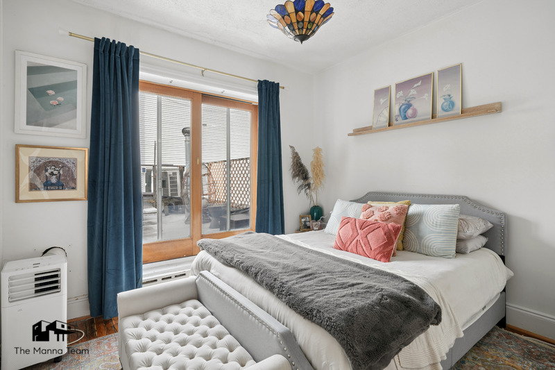 495 Lorimer Street Brooklyn, NY 11211 - Photo 7 of 24 a bedroom with a large bed and a window