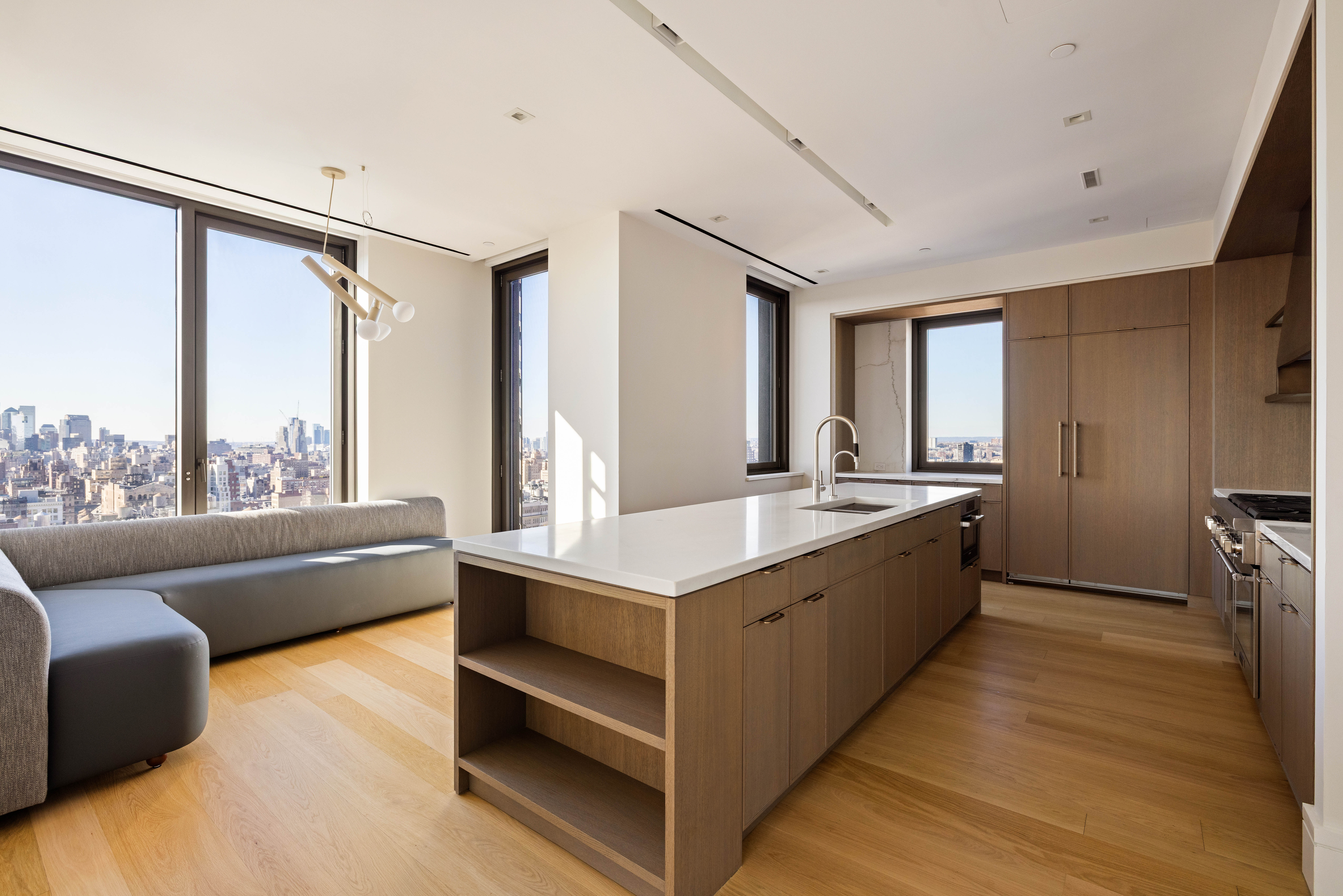 39 West 23rd Street, Unit PH Manhattan, NY 10010 - Photo 5 of 20 a large white room with a large window and a wooden floor