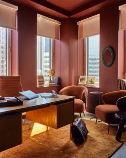 a bedroom with furniture and a window