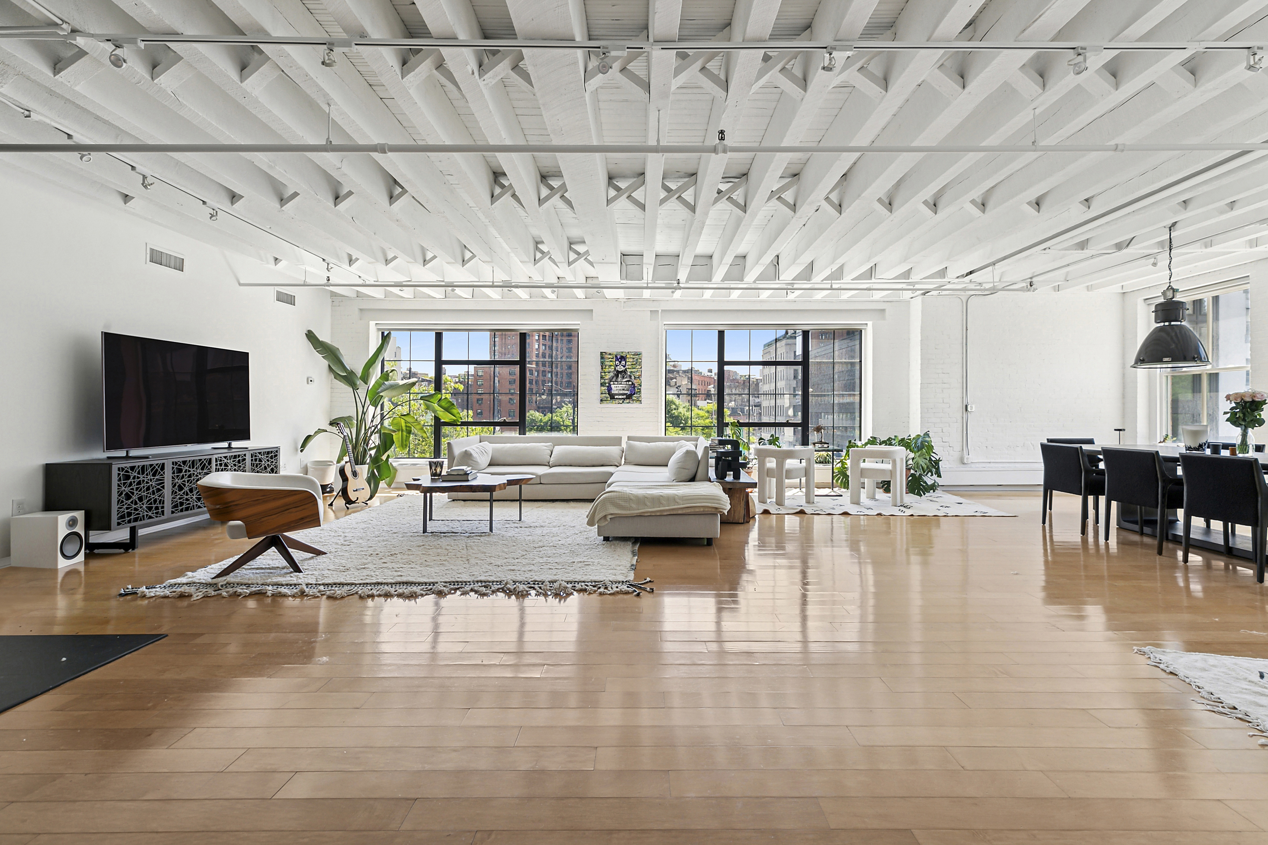 a living room with fireplace furniture and a flat screen tv