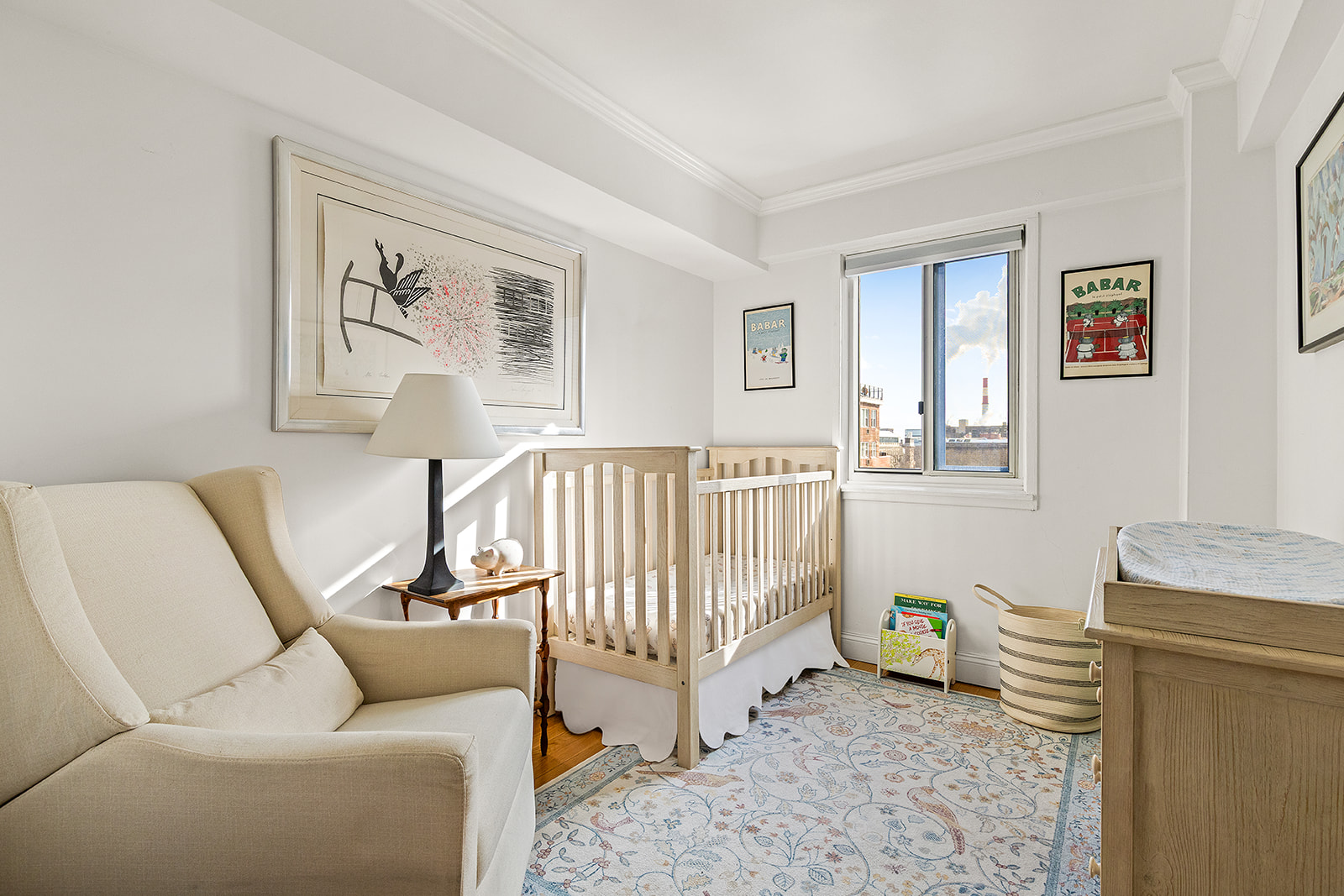 401 East 65th Street, Unit 11HI Manhattan, NY 10065 - Photo 4 of 10 a living room with furniture and a wooden floor