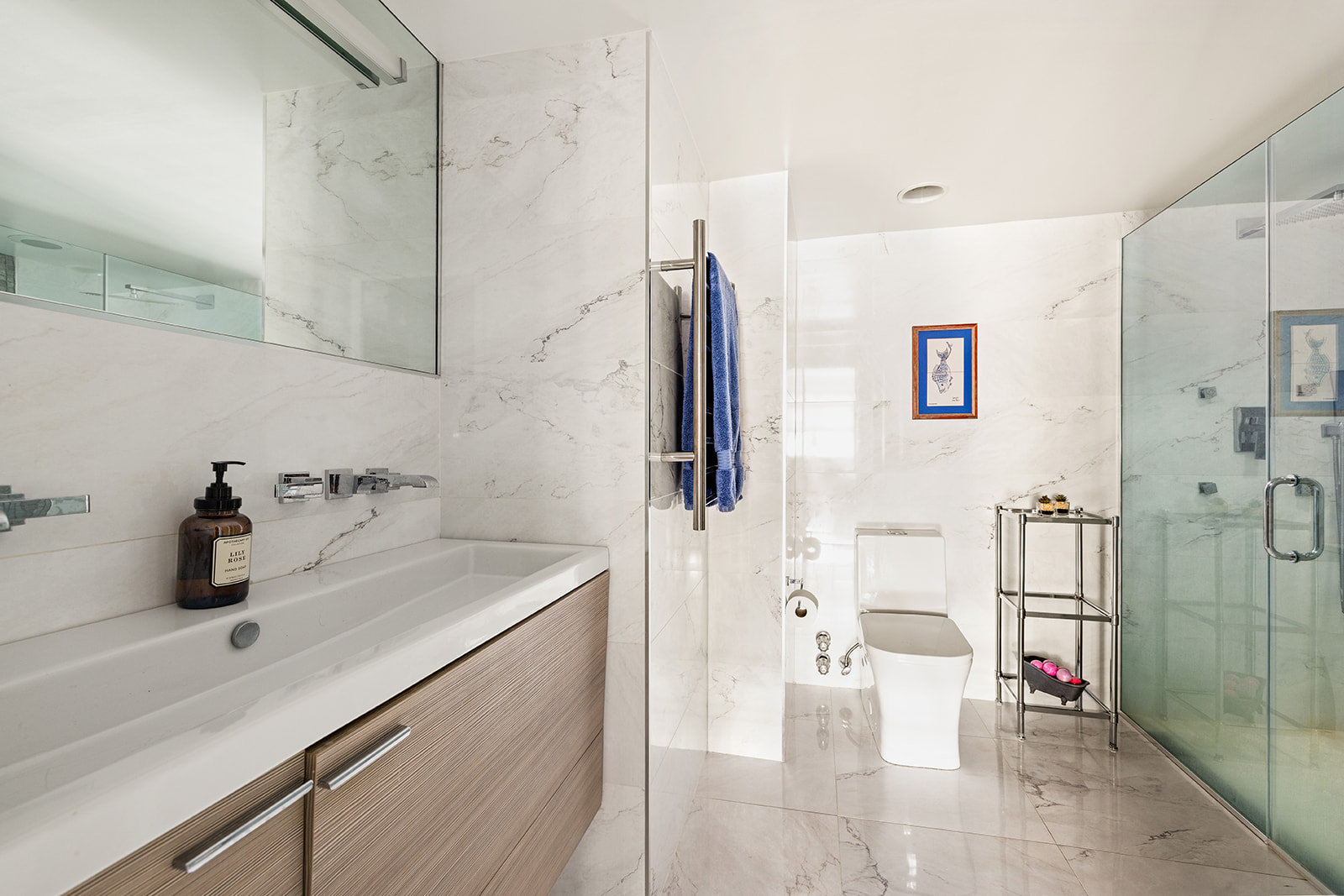 330 East 49th Street, Unit 12E Manhattan, NY 10017 - Photo 12 of 16 a bathroom with a sink and mirror