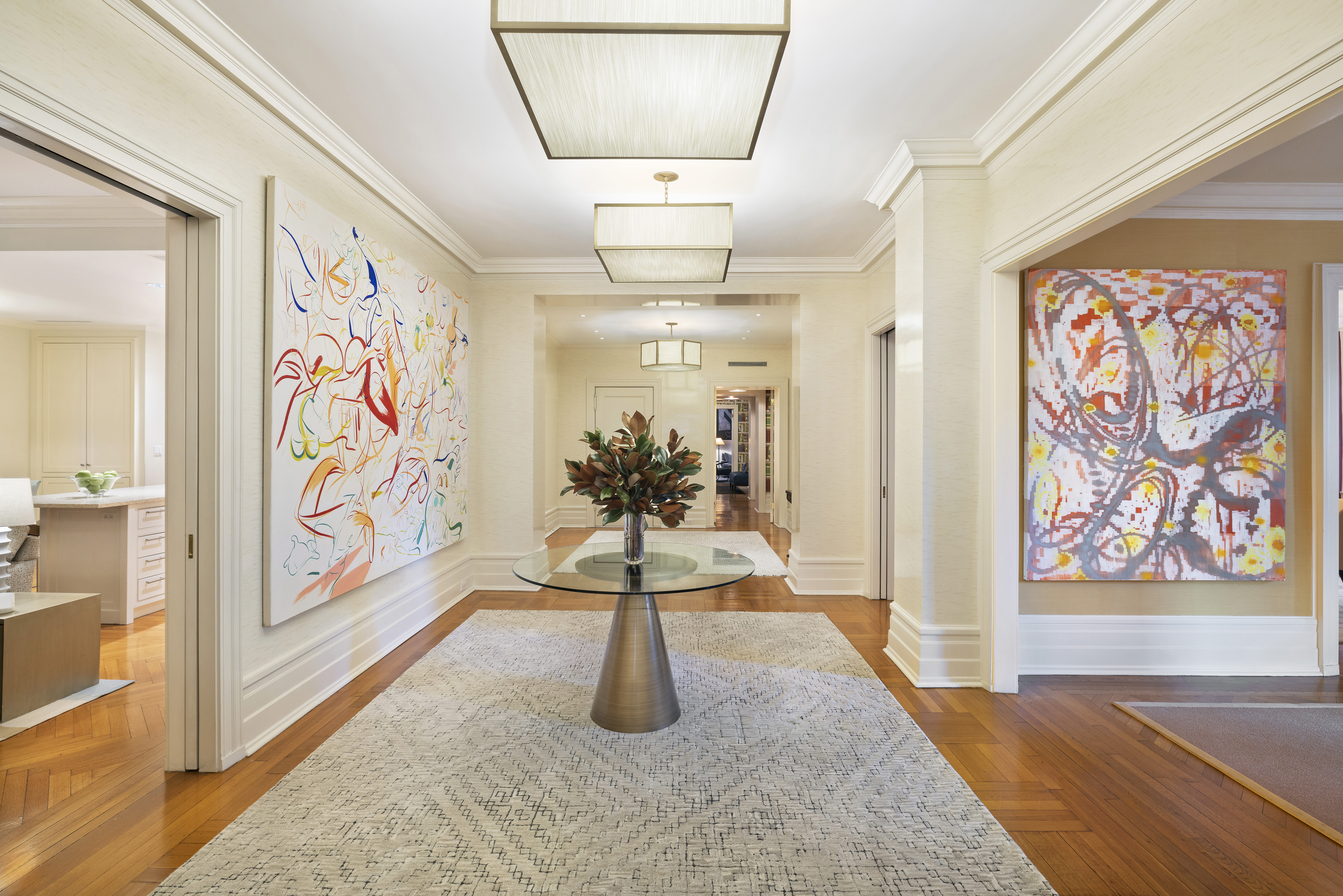 325 West End Avenue, Unit 6AB Manhattan, NY 10023 - Photo 6 of 22 a hallway with a couch and a painting on the wall