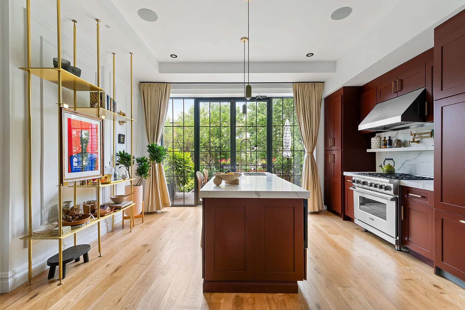 a kitchen with stainless steel appliances granite countertop a stove and a refrigerator