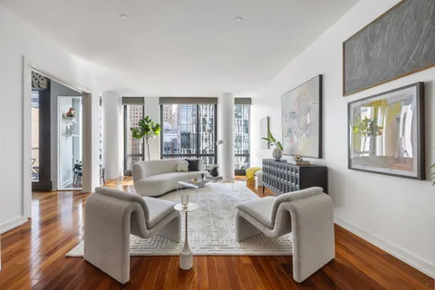 a living room with furniture and a window