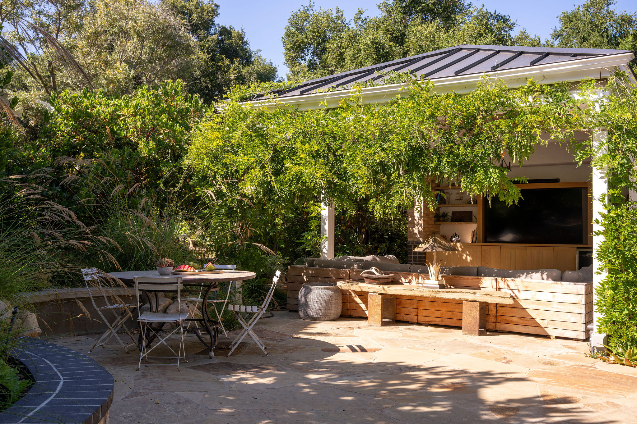 560 Cold Canyon Road Calabasas, CA 91302 - Photo 75 of 84 an outdoor space with furniture and umbrella