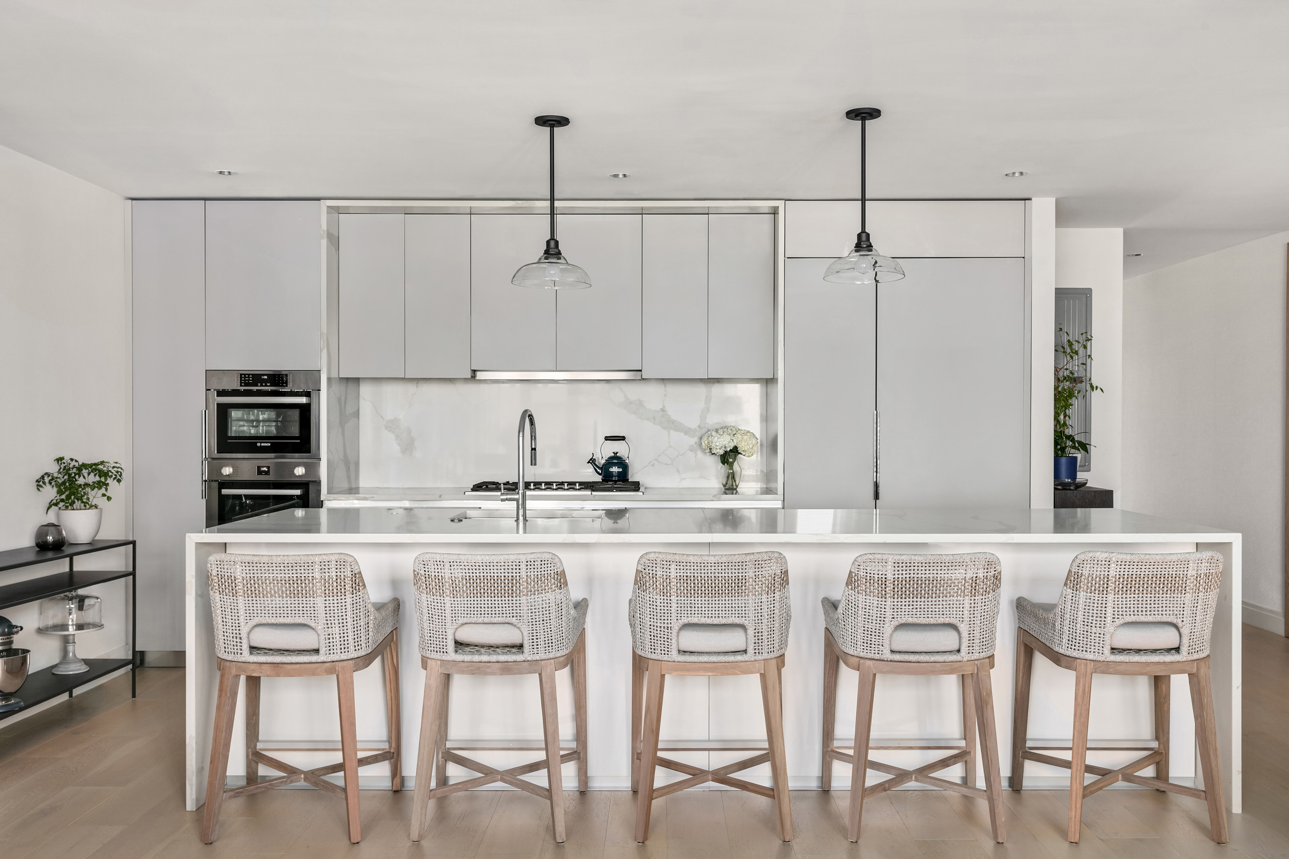 212 West 95th Street, Unit 4B Manhattan, NY 10025 - Photo 4 of 13 a kitchen with granite countertop cabinets and chairs
