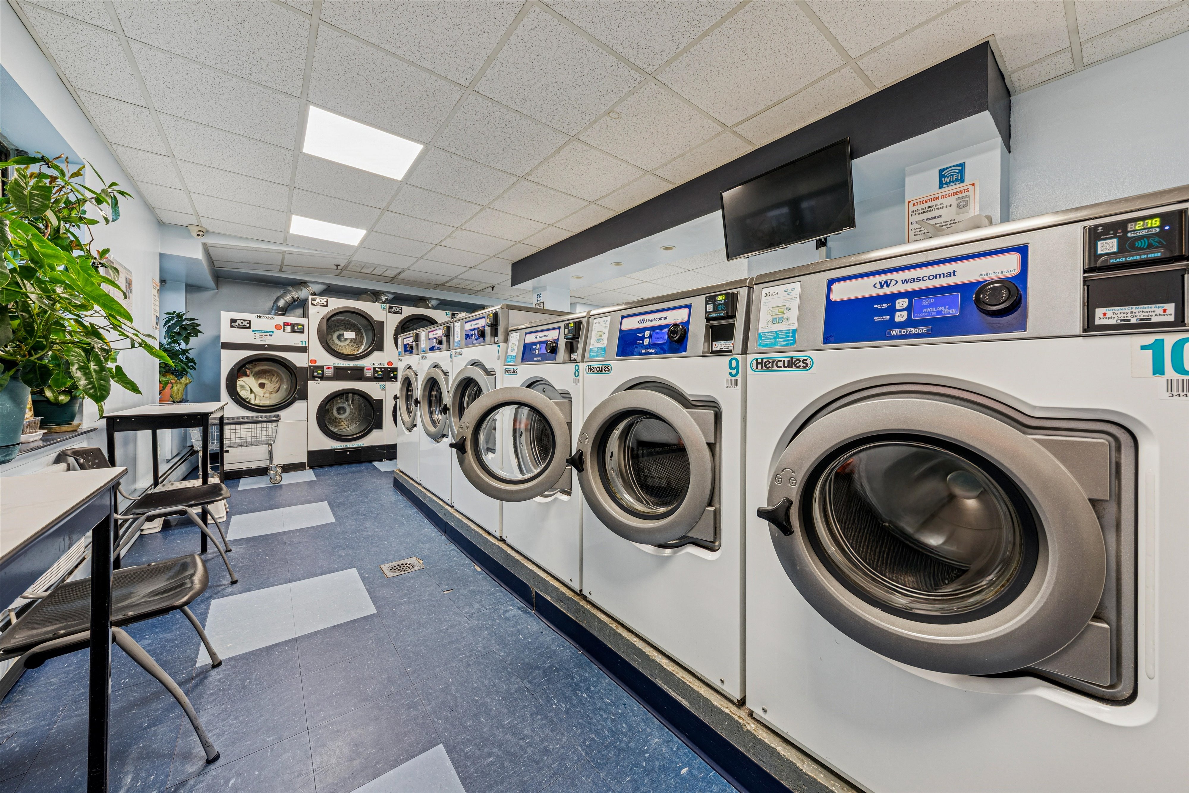 1919 Madison Avenue, Unit 418 Manhattan, NY 10035 - Photo 12 of 16 a utility room with dryer and washer