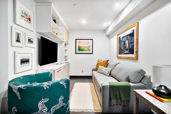 a living room with furniture fireplace and flat screen tv