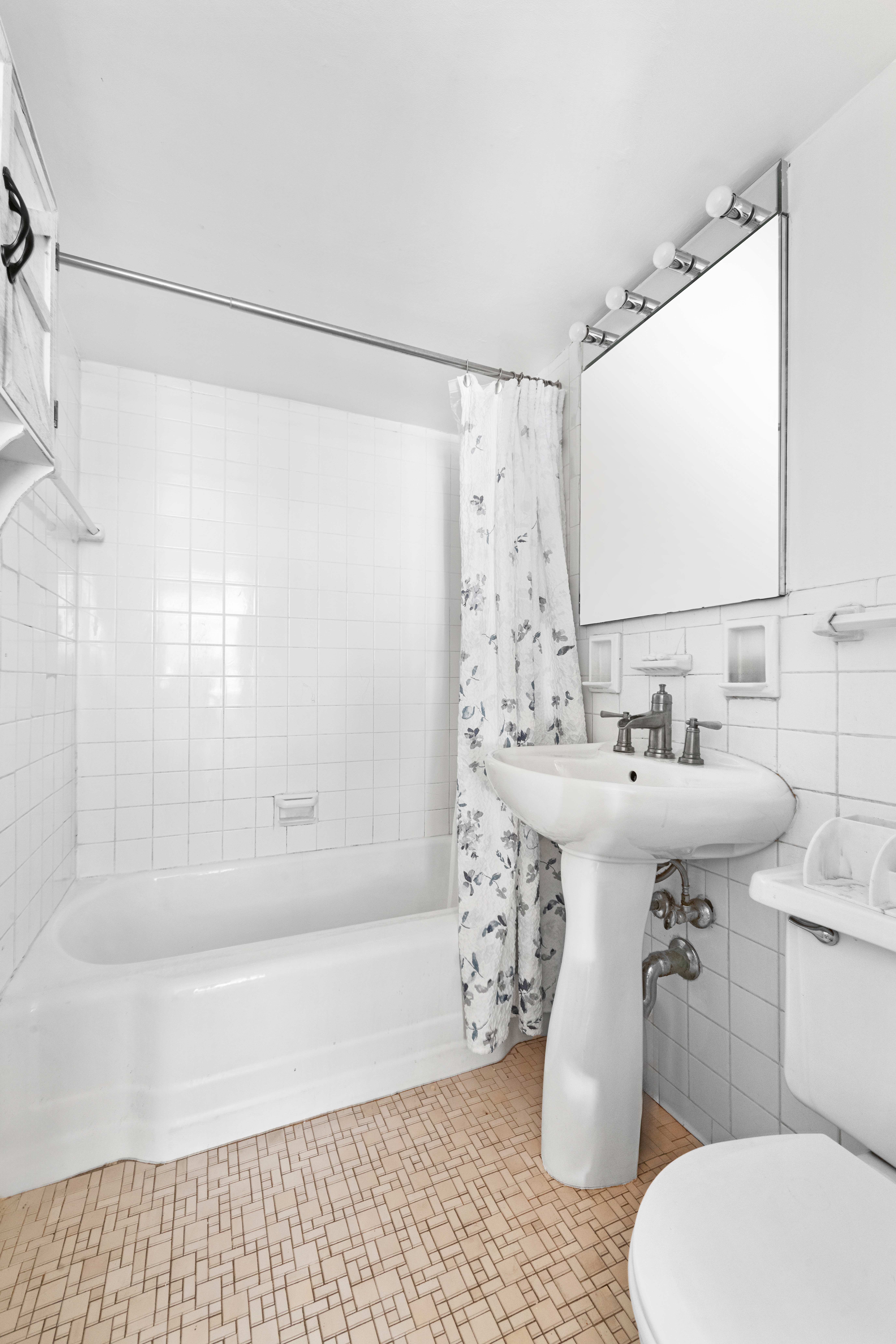 130 East 18th Street, Unit 3K Manhattan, NY 10003 - Photo 6 of 9 a bathroom with a sink toilet and shower