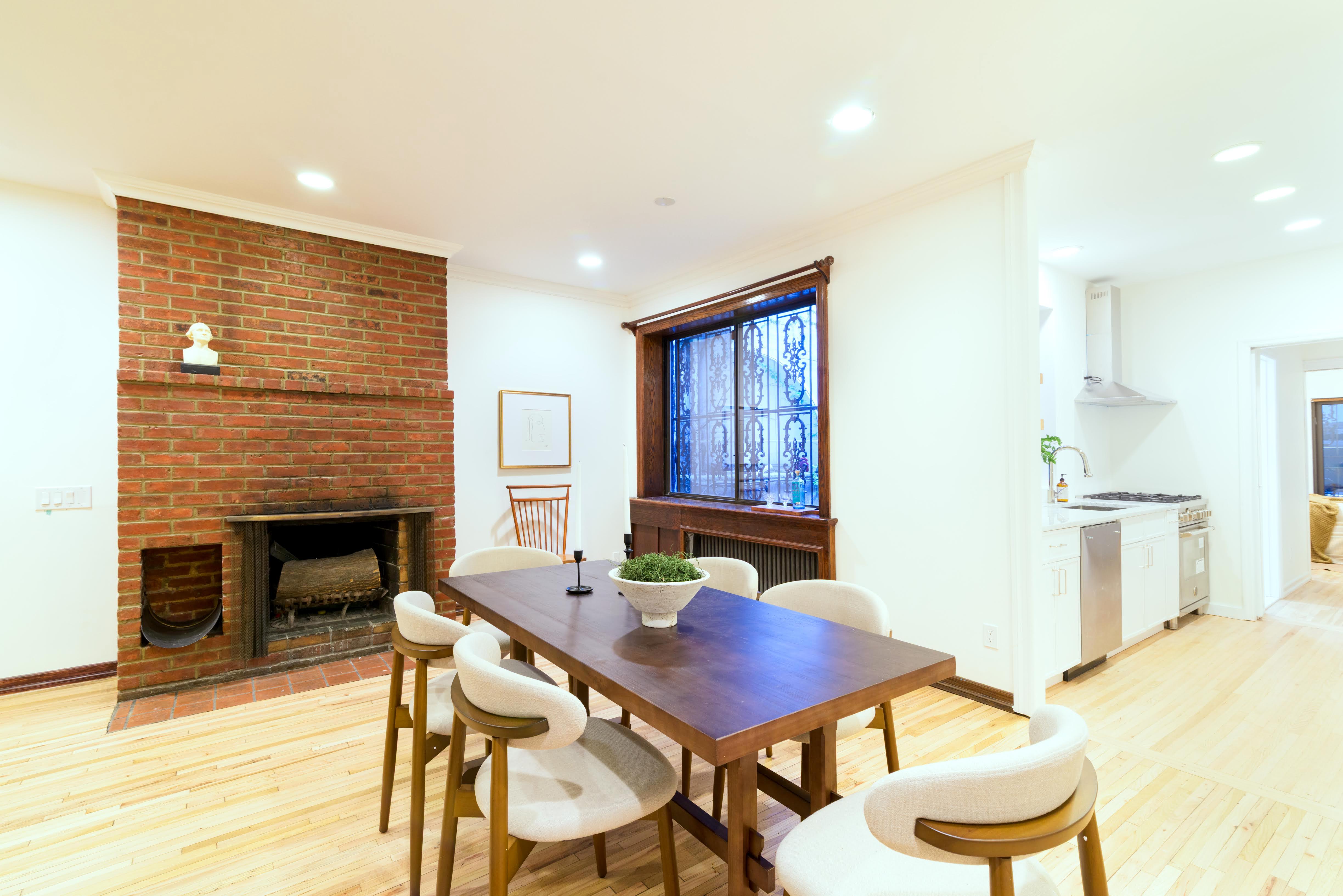 349 West 71st Street Manhattan, NY 10023 - Photo 3 of 21 a living room with furniture a fireplace and a table