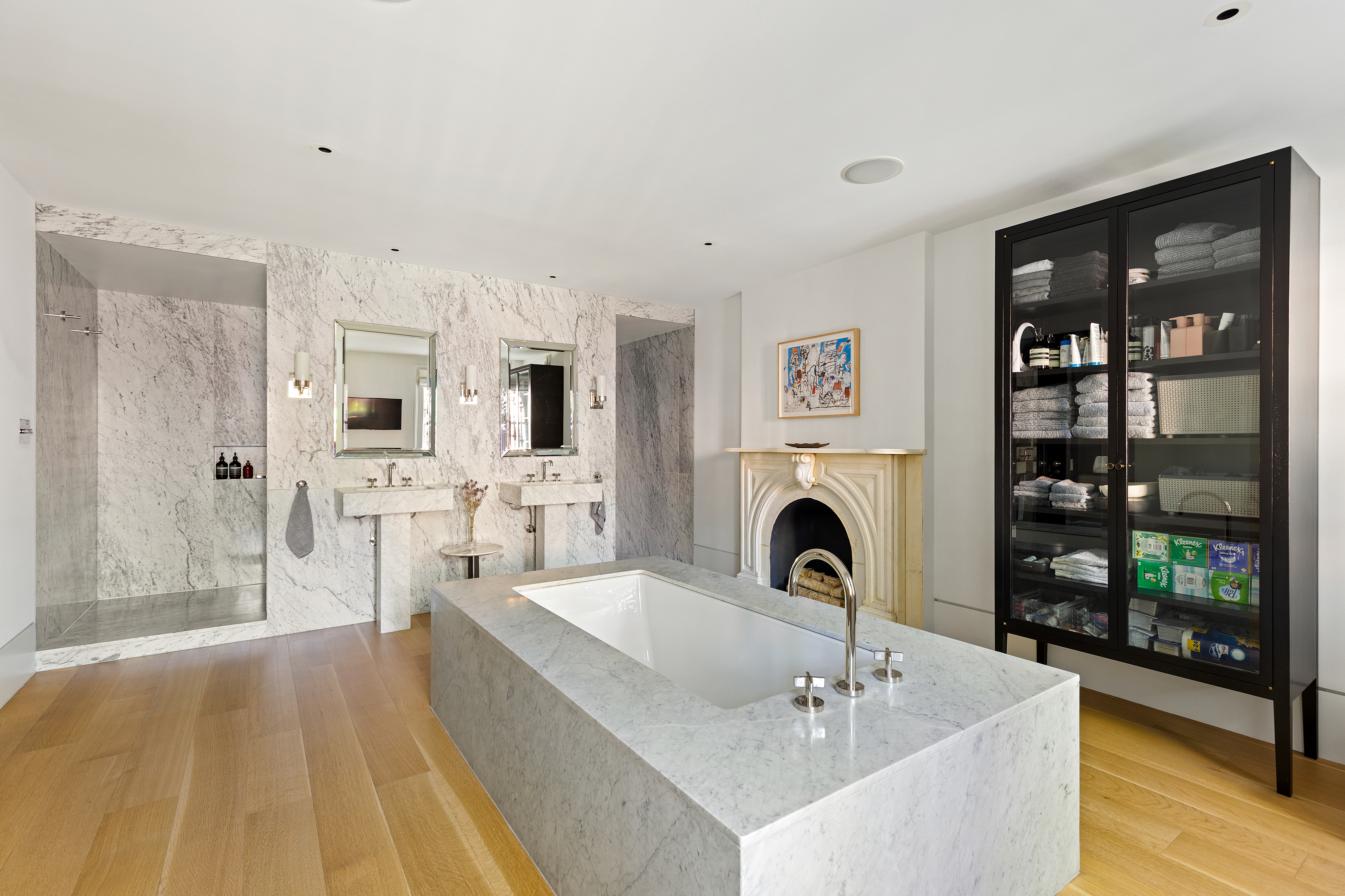 315 Adelphi Street Brooklyn, NY 11205 - Photo 17 of 31 a spacious bedroom with a bed and a fireplace