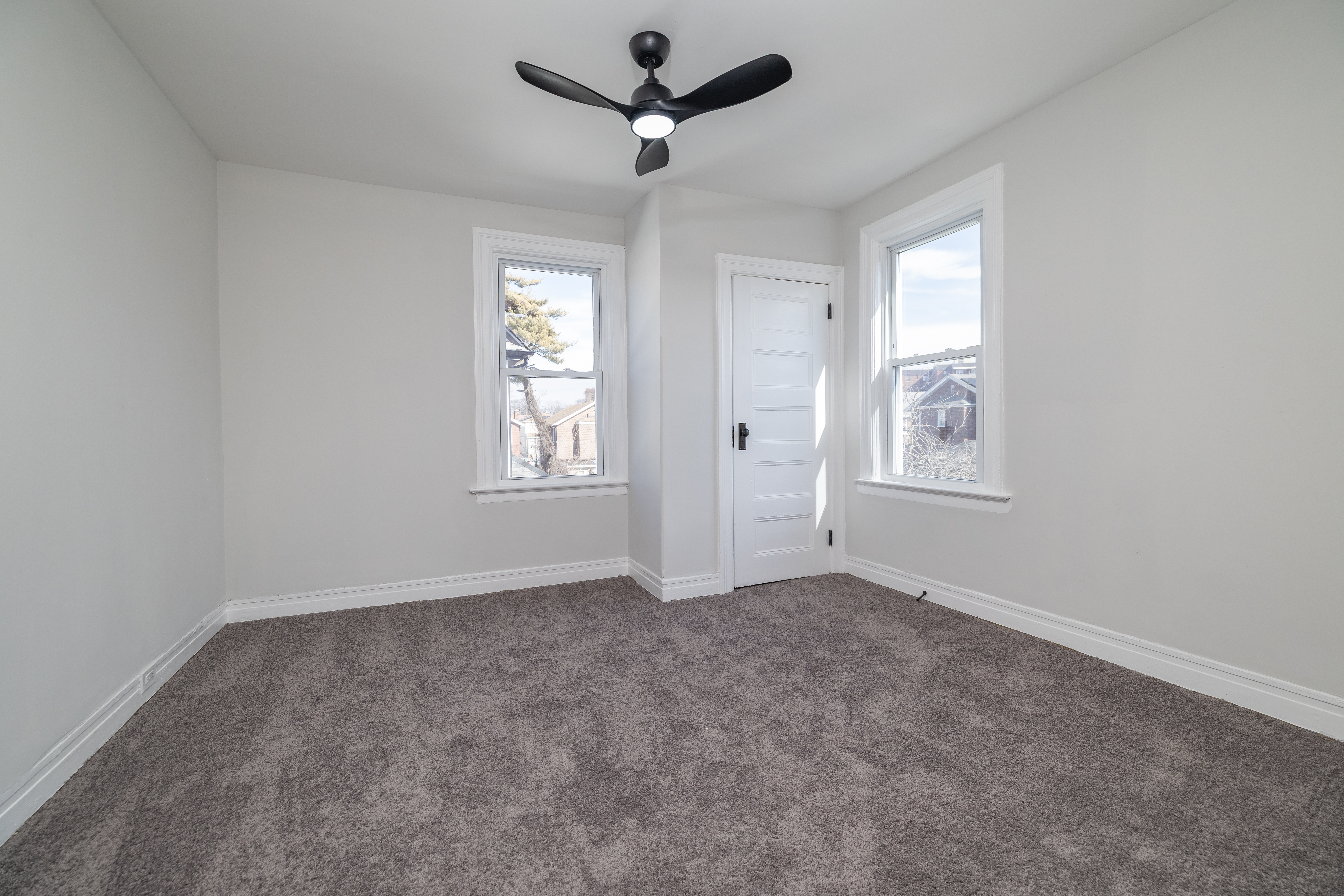 13-03 Brunswick Avenue Queens, NY 11691 - Photo 17 of 27 an empty room with windows and fan