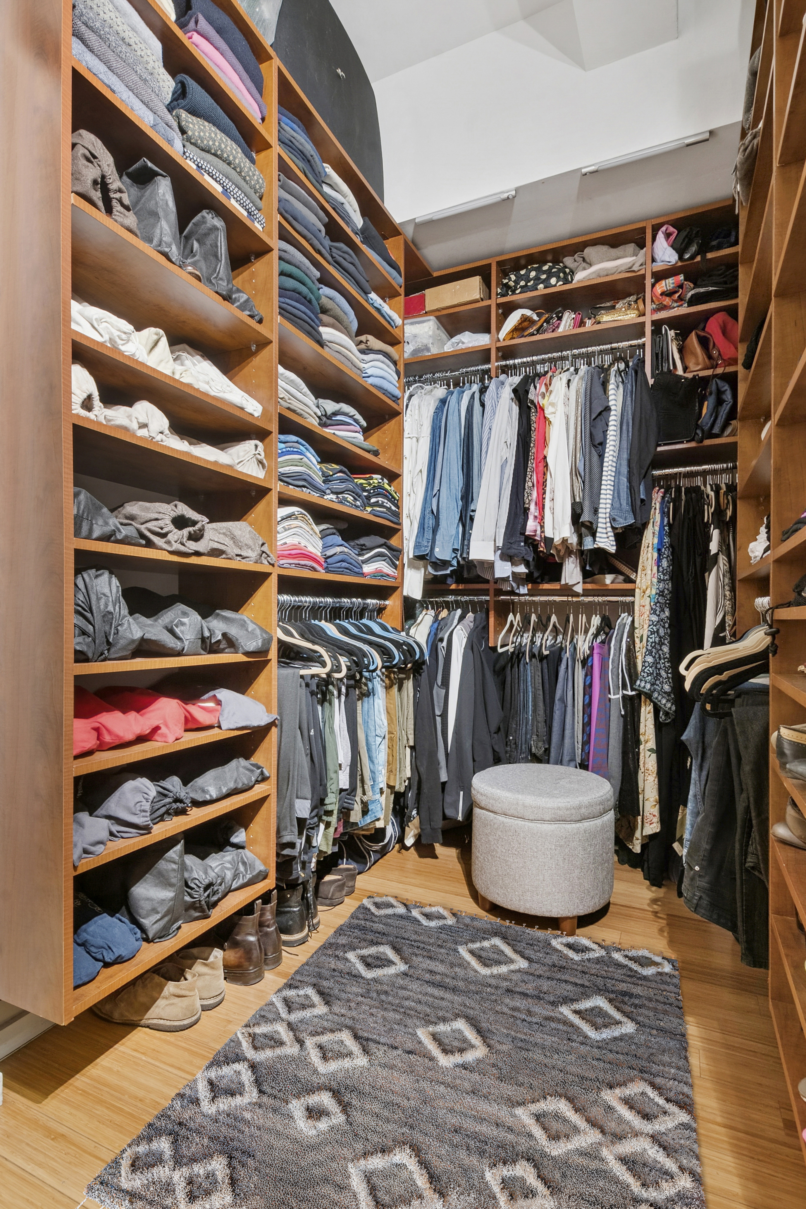365 Bridge Street, Unit 7G Brooklyn, NY 11201 - Photo 6 of 12 a view of walk in closet with clothes and shoes