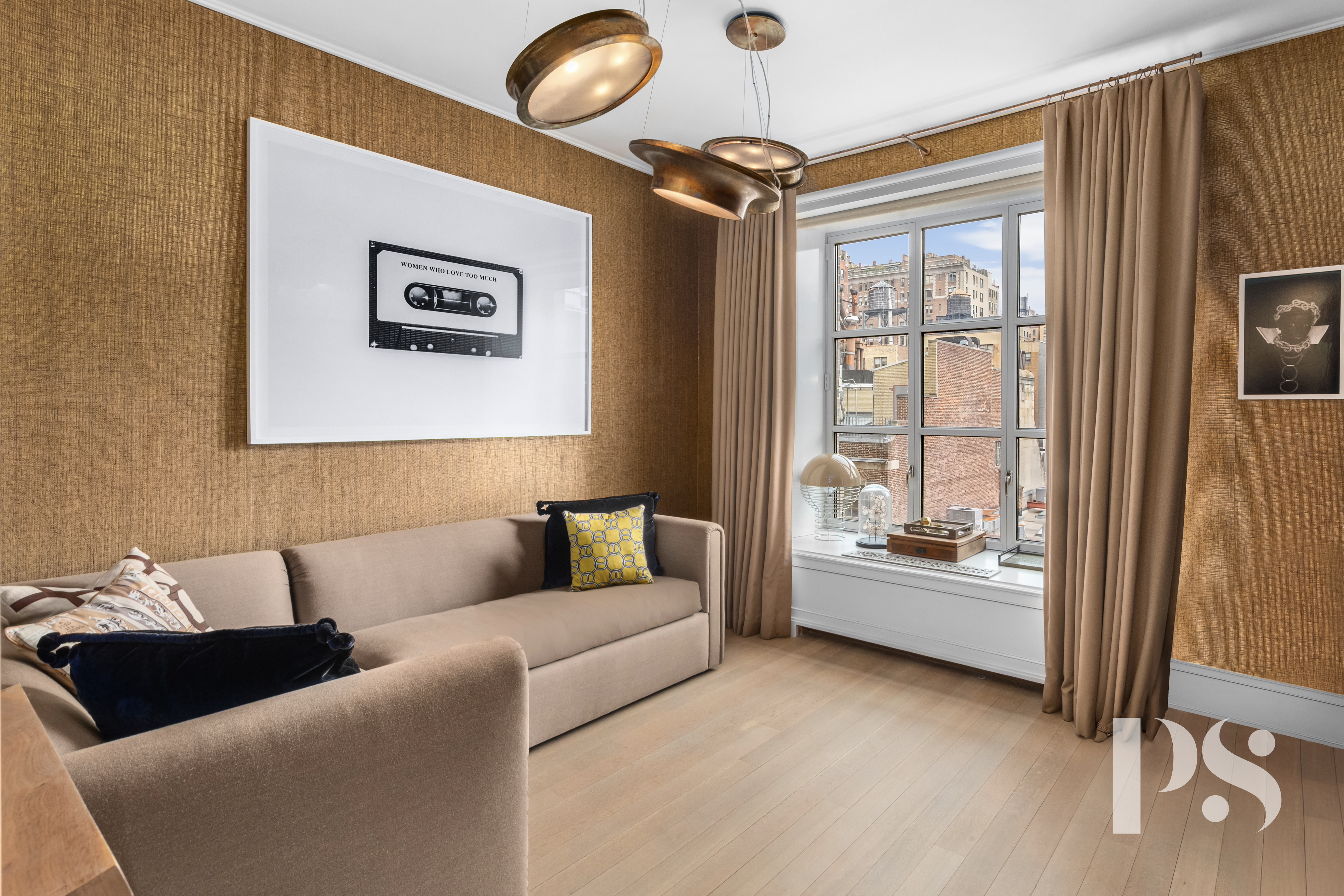 135 East 79th Street, Unit 8E Manhattan, NY 10075 - Photo 20 of 26 a living room with furniture and a large window