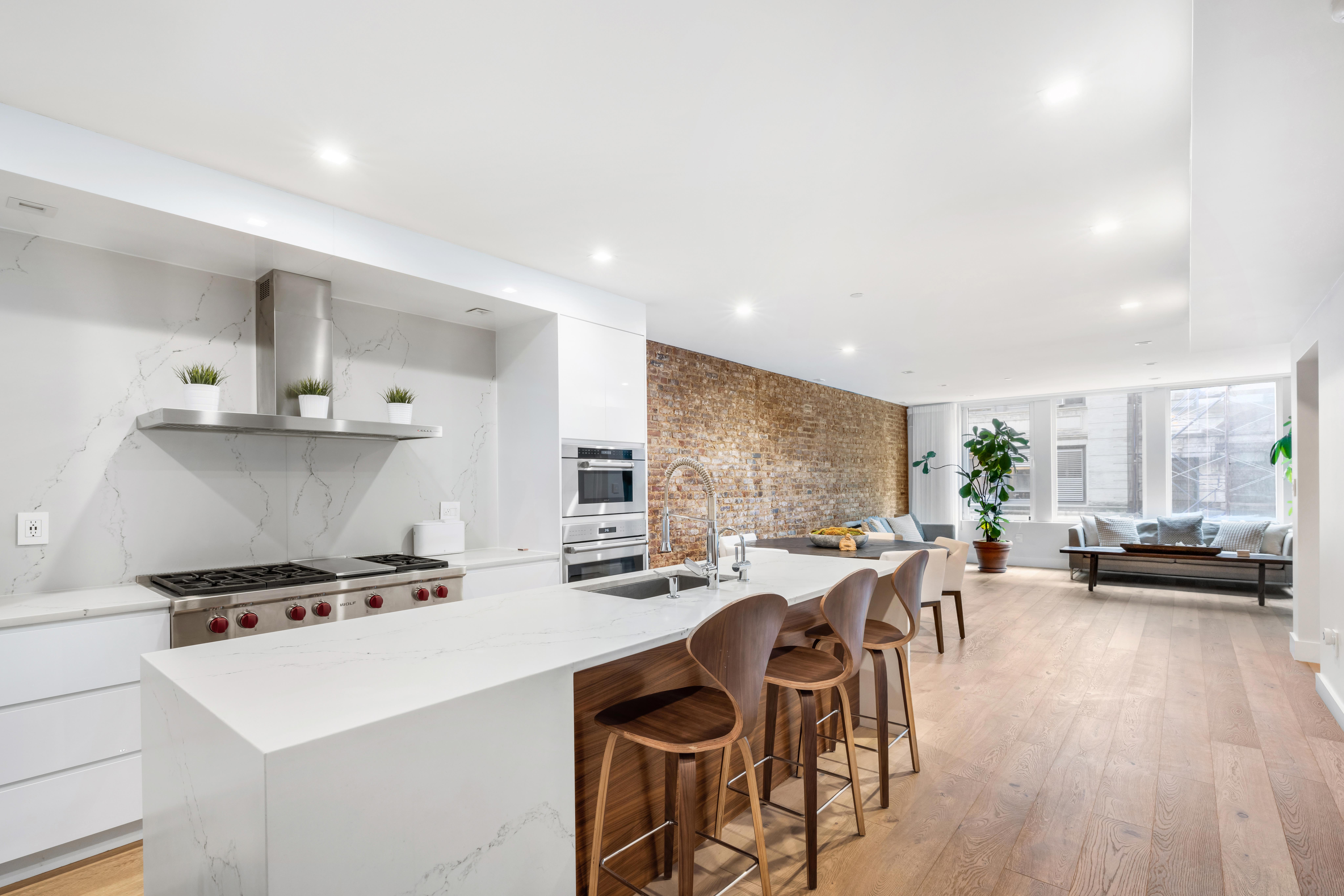17 East 17th Street, Unit 4 Manhattan, NY 10003 - Photo 4 of 11 a kitchen with a table and chairs