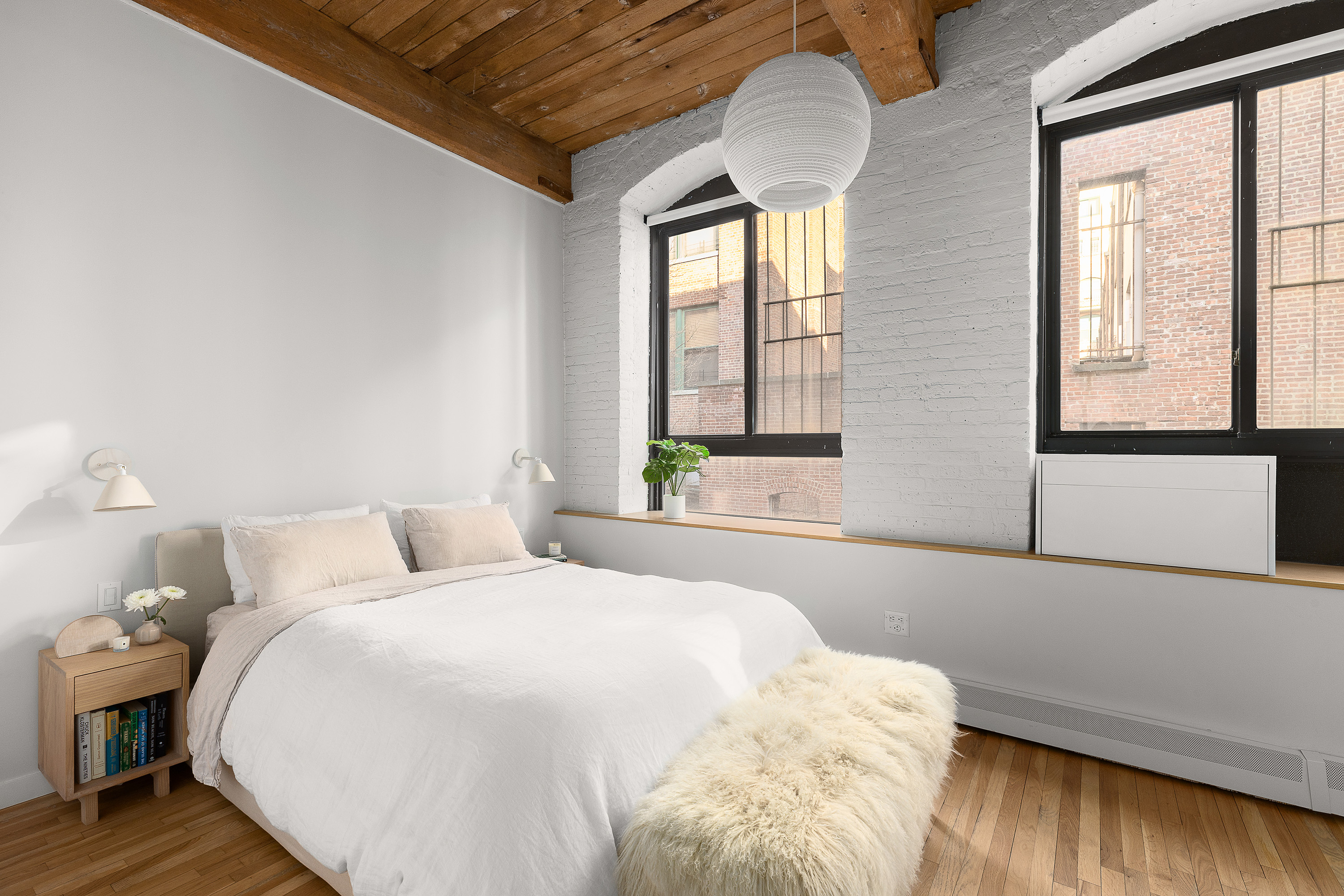 420 12th Street, Unit E1L Brooklyn, NY 11215 - Photo 8 of 15 a spacious bedroom with a bed and a large window