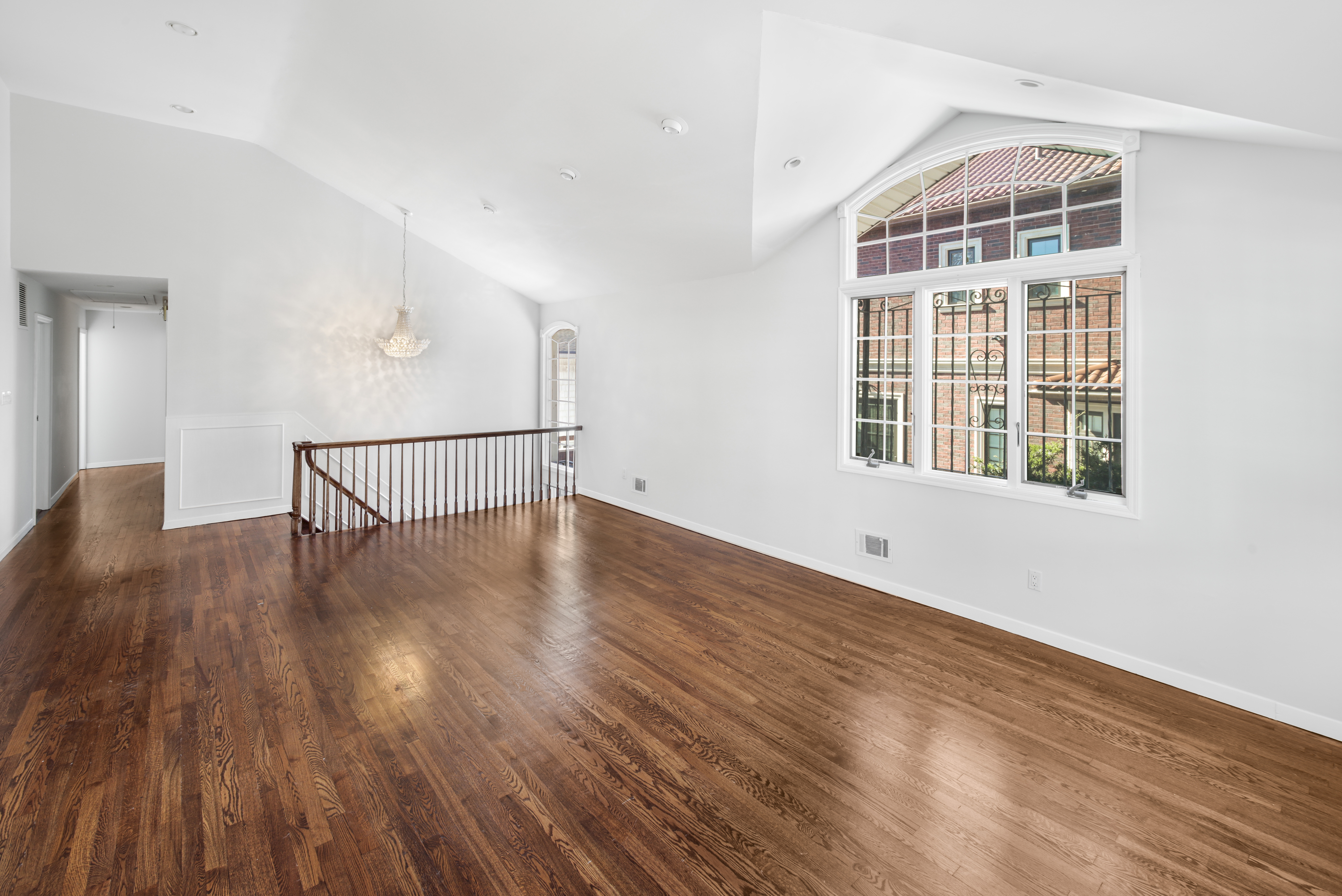 60 82nd Street Brooklyn, NY 11209 - Photo 4 of 19 a view of an empty room with wooden floor and a window