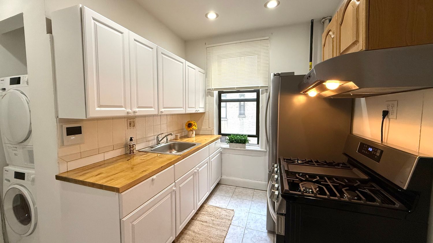 a kitchen with a stove and a refrigerator