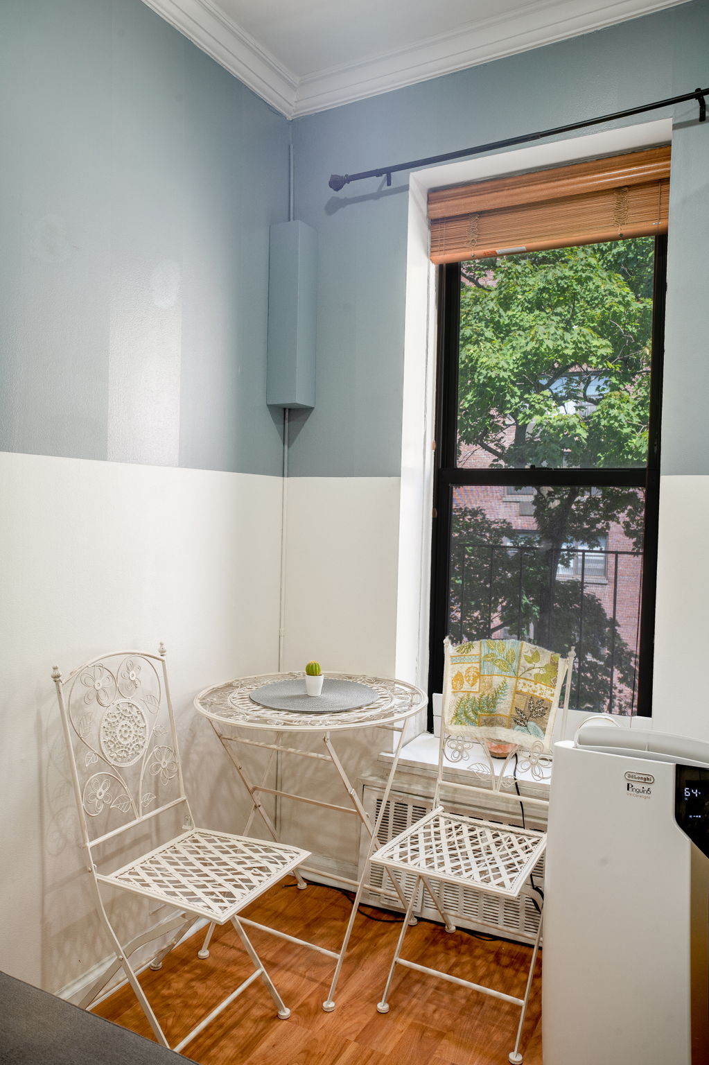 425 East 78th Street, Unit 4A Manhattan, NY 10075 - Photo 4 of 9 a living room with a couch and a table