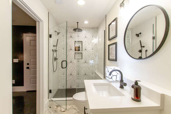 1203 Brick Church Pike Nashville, TN 37207 - Photo 29 of 44 a bathroom with a sink and a mirror
