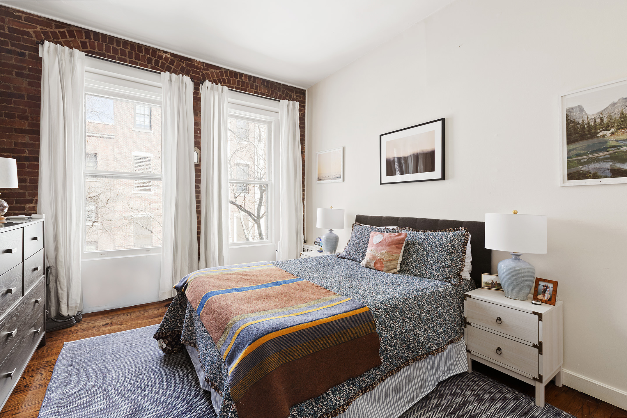 138 West 73rd Street Manhattan, NY 10023 - Photo 22 of 35 a bedroom with a bed and a window