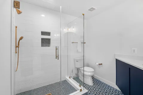 a city street lined with buildings and trees