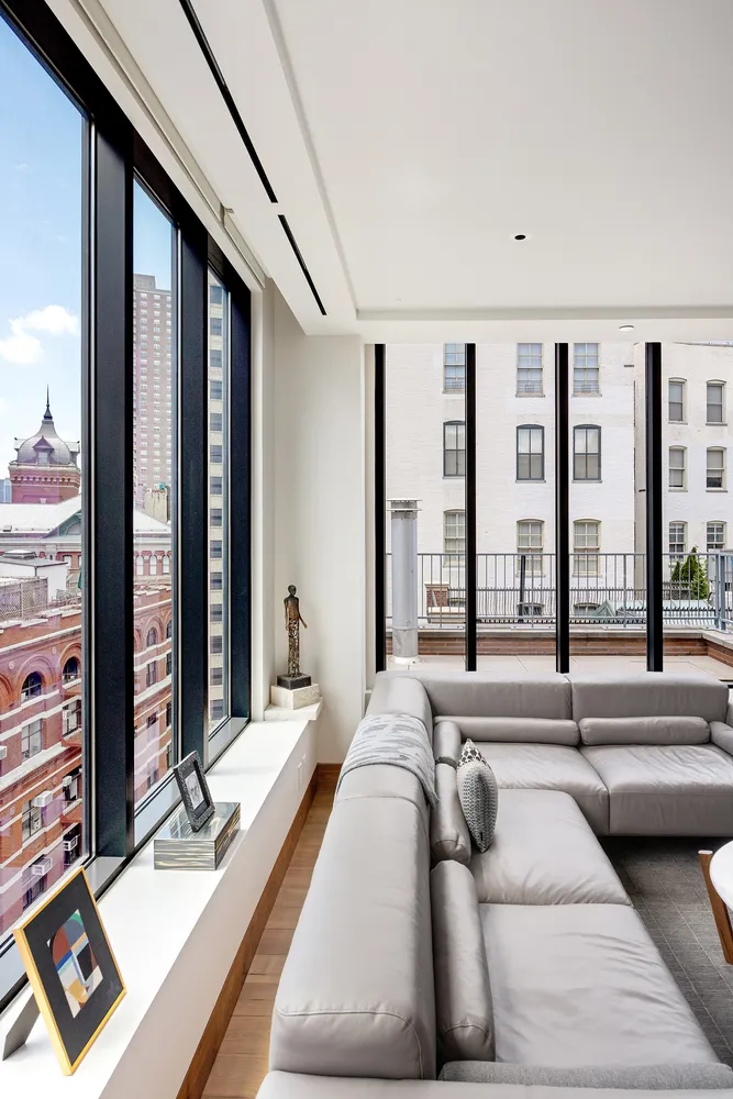 a view of a living room and a balcony