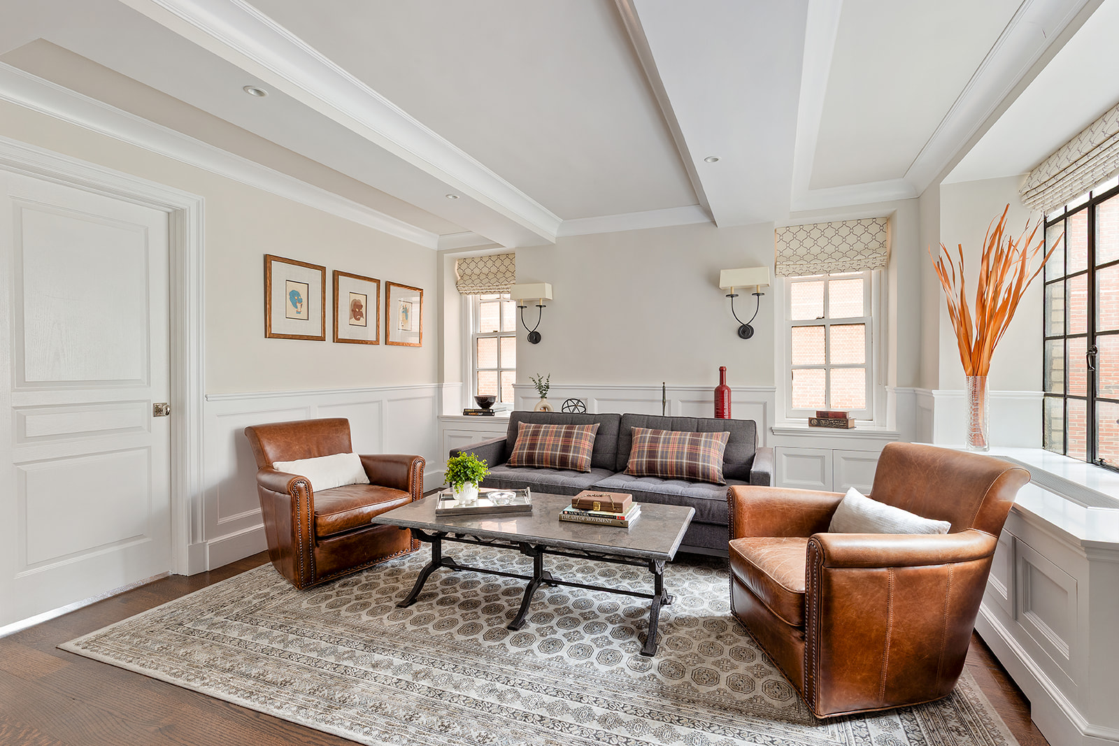 a living room with furniture a rug and a window