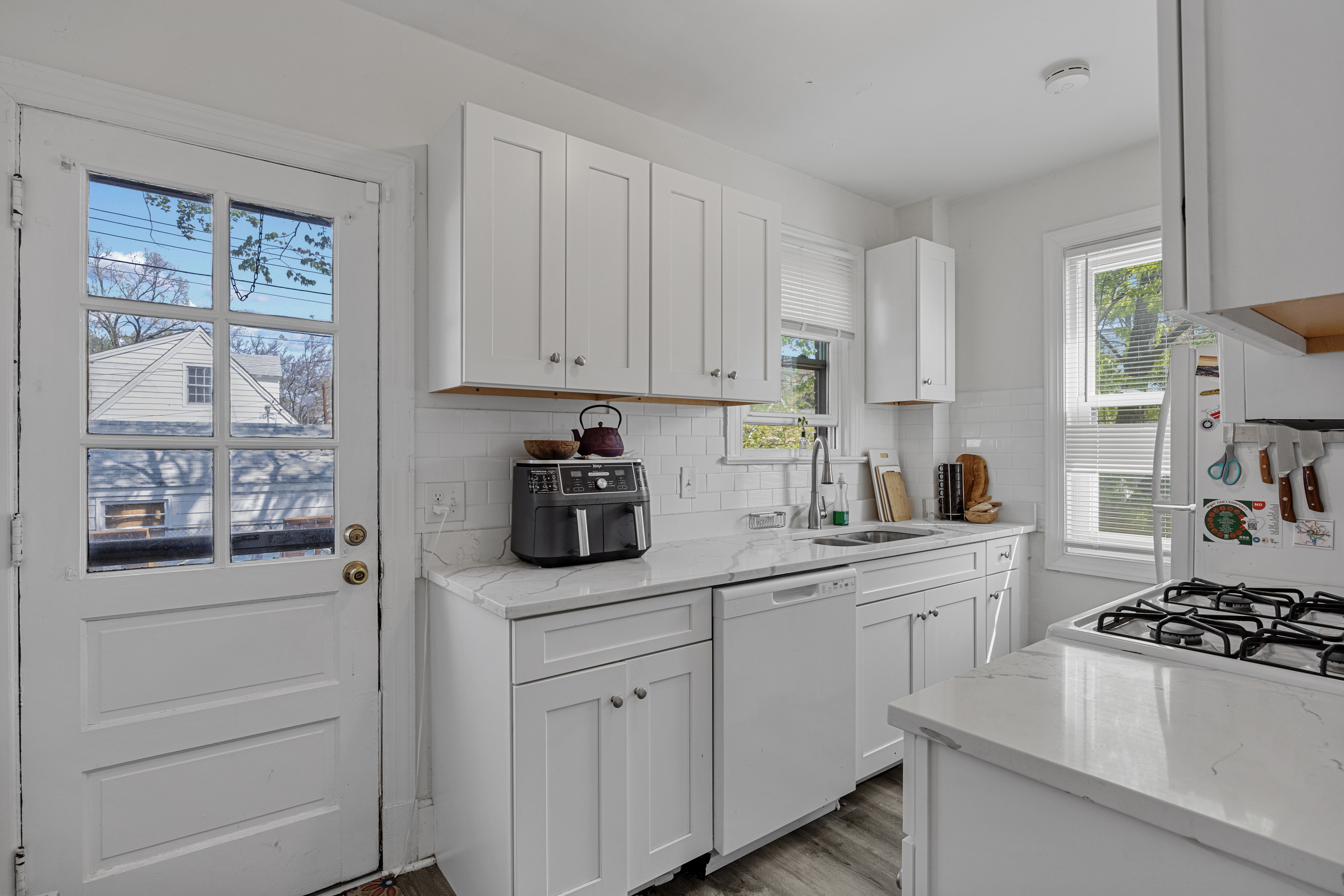 34 East Walnut Street Alexandria, VA 22301 - Photo 5 of 15 a kitchen with white cabinets and appliances