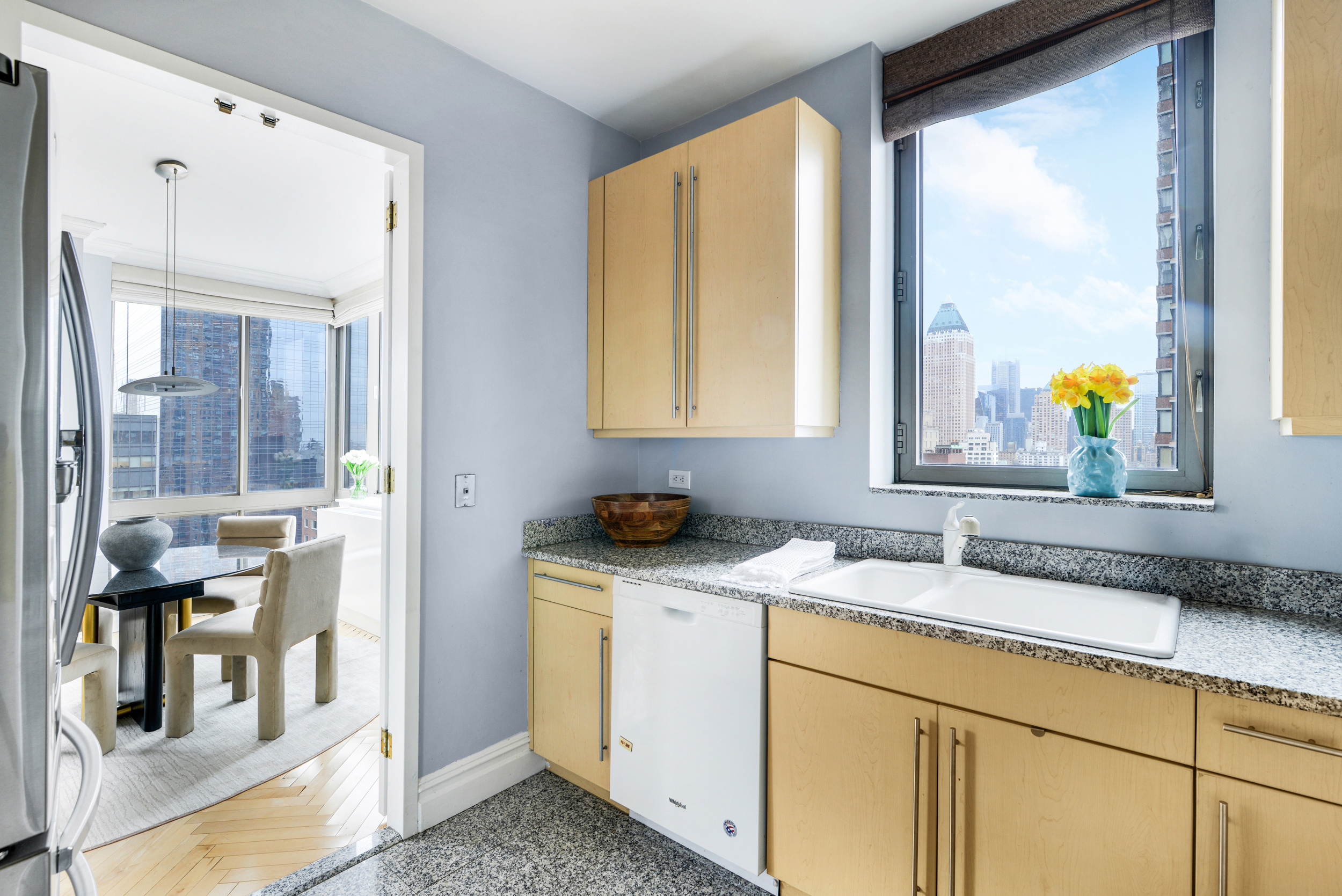 2 Columbus Avenue, Unit 17C Manhattan, NY 10023 - Photo 7 of 19 a bathroom with a granite countertop sink and a mirror