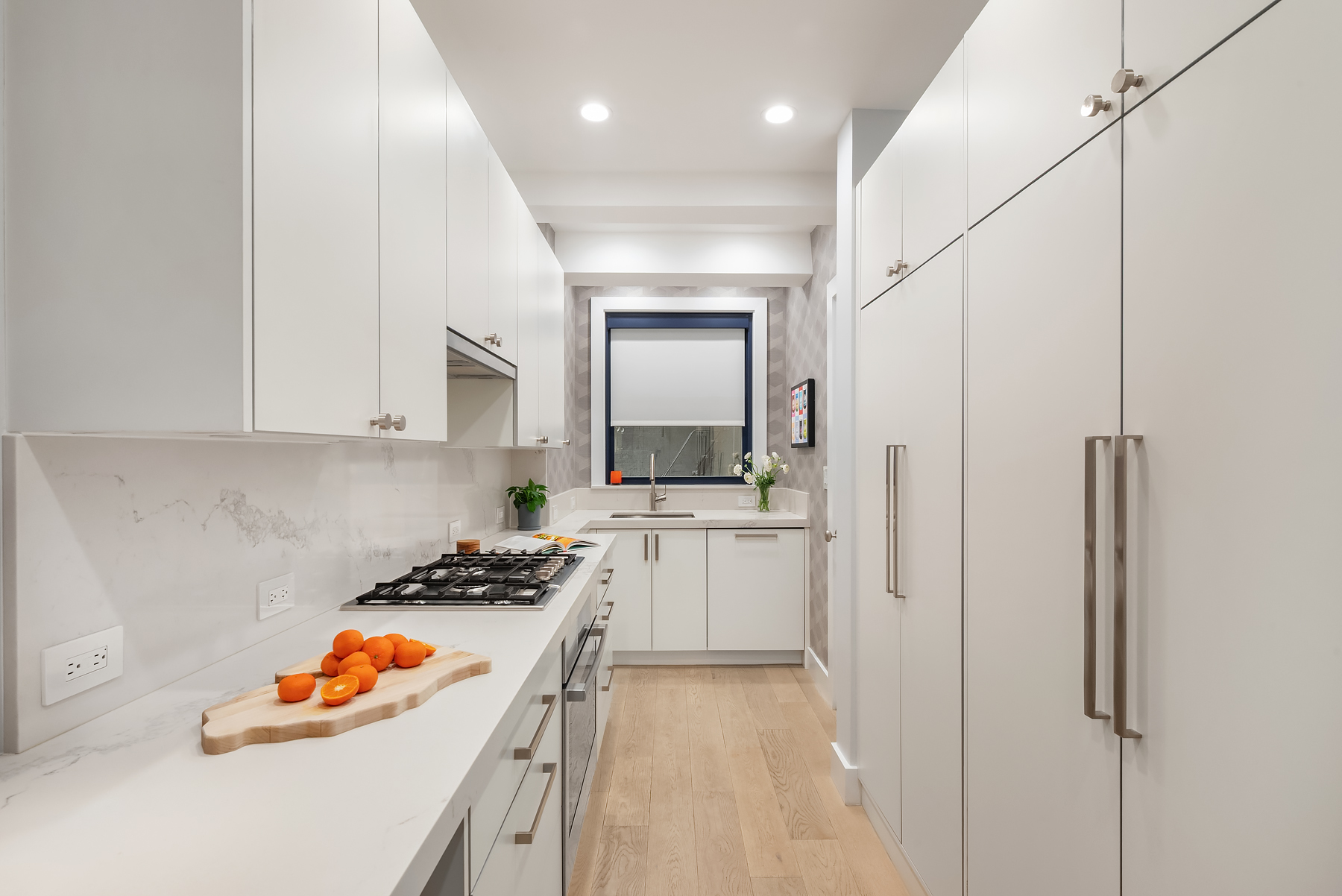 a kitchen with stainless steel appliances granite countertop a sink and cabinets
