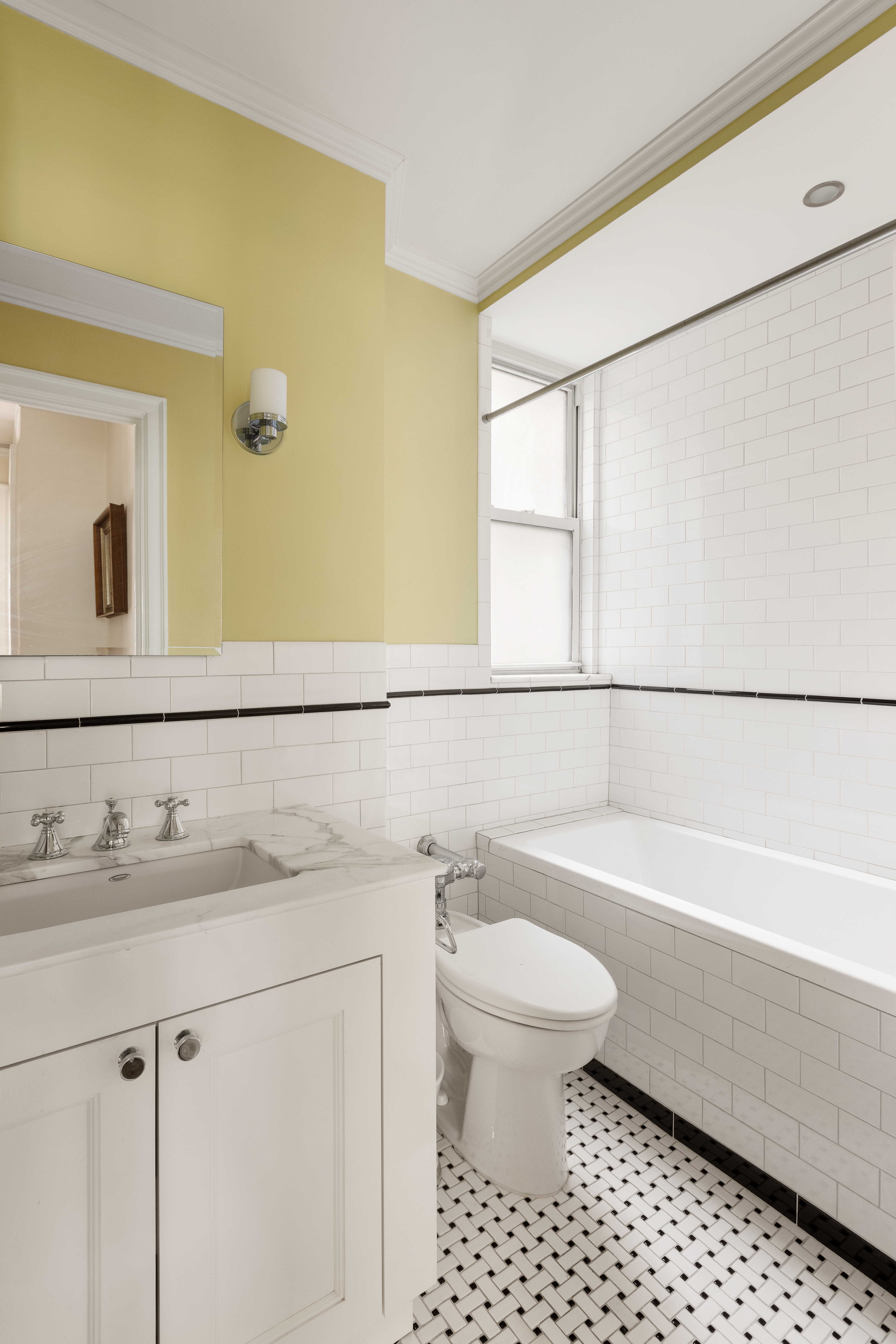 41 West 96th Street, Unit 4B Manhattan, NY 10025 - Photo 11 of 15 a bathroom with a bathtub sink vanity mirror and toilet