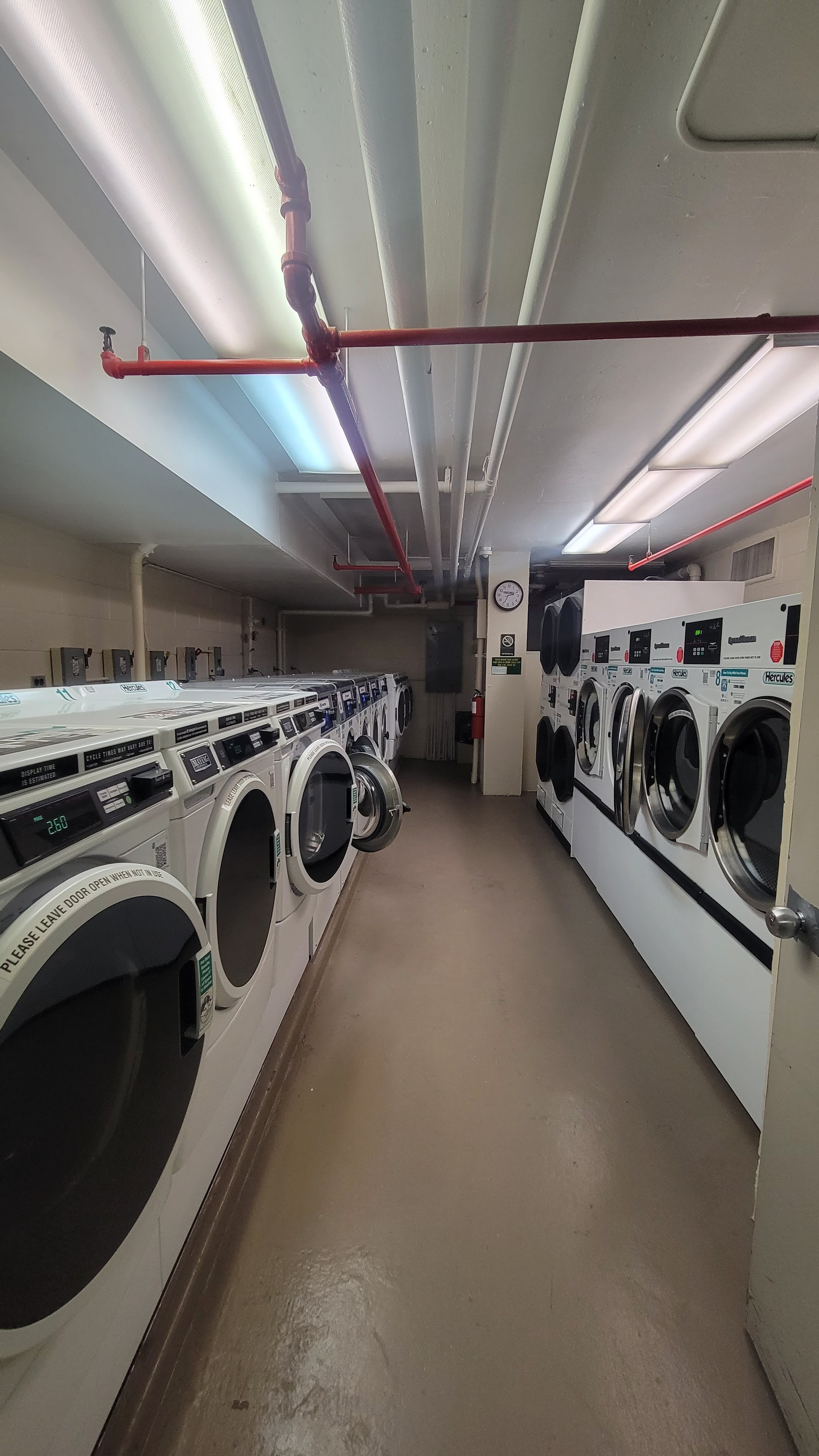 376 Broadway, Unit 6F Manhattan, NY 10013 - Photo 15 of 17 a utility room with dryer and washer