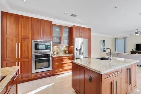 a view of a house with a swimming pool and a yard