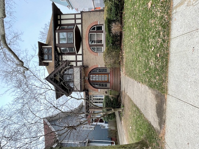 front view of a house with a small yard