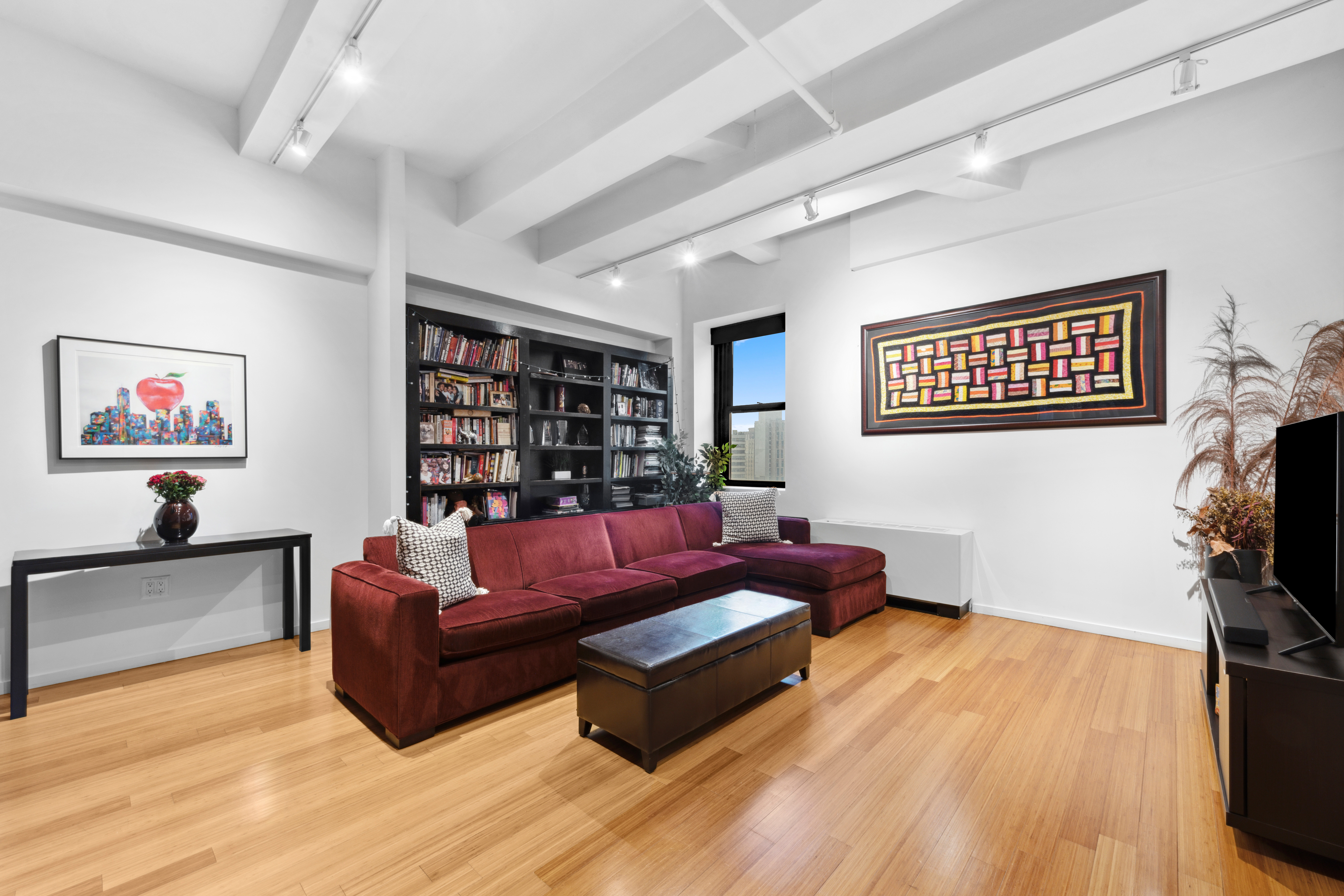 365 Bridge Street, Unit 12H Brooklyn, NY 11201 - Photo 3 of 12 a living room with furniture and a flat screen tv