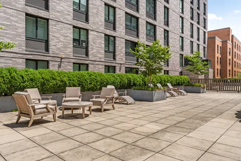 a view of a building with sitting area
