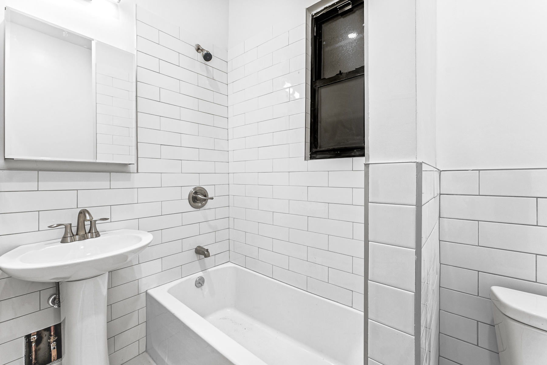 280 Suydam Street, Unit 2R Brooklyn, NY 11237 - Photo 5 of 6 a bathroom with a bathtub and sink