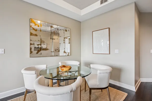 a living room with furniture and next to a window