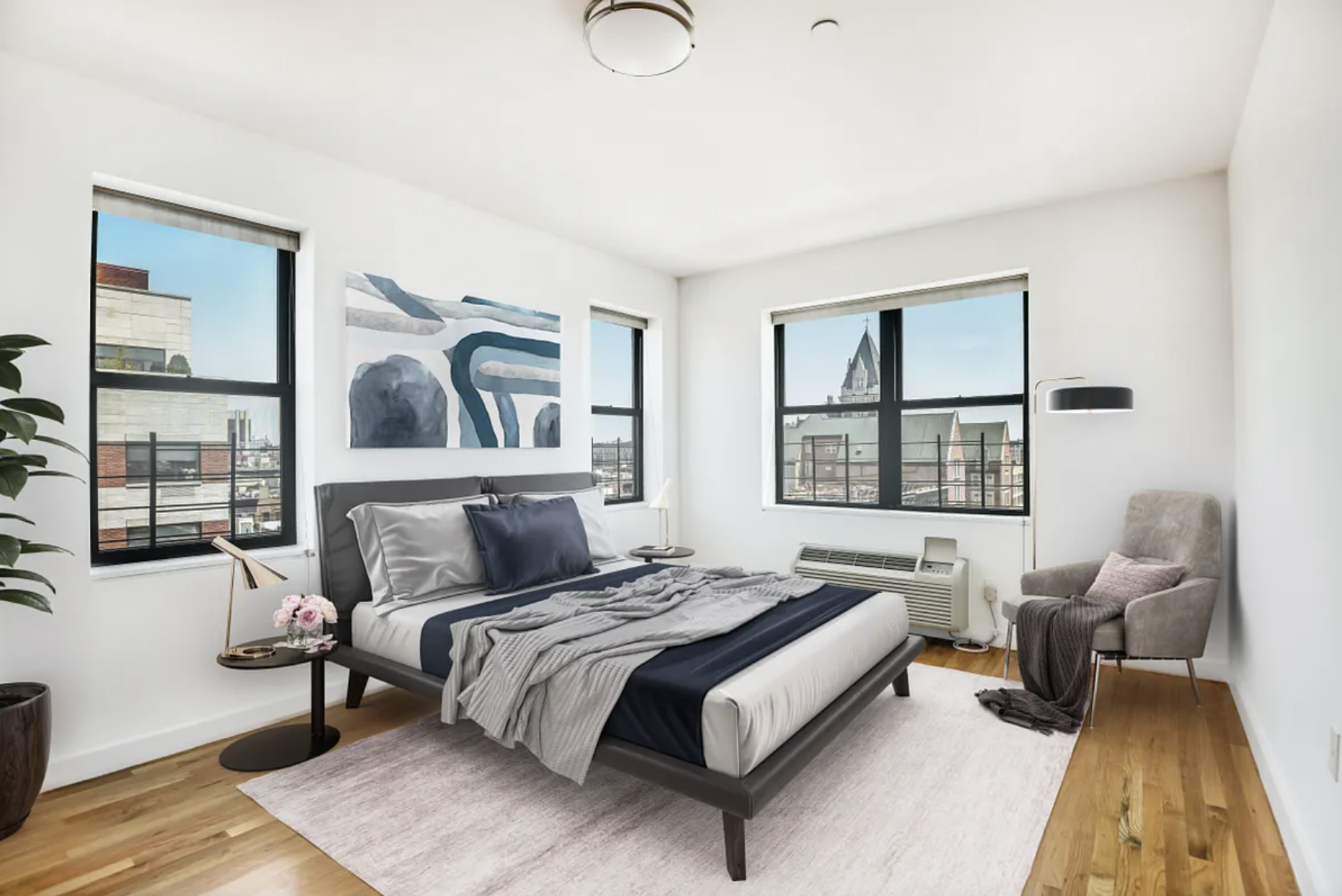 2098 Frederick Douglass Boulevard, Unit 7M Manhattan, NY 10026 - Photo 6 of 15 a bedroom with a bed and a large window