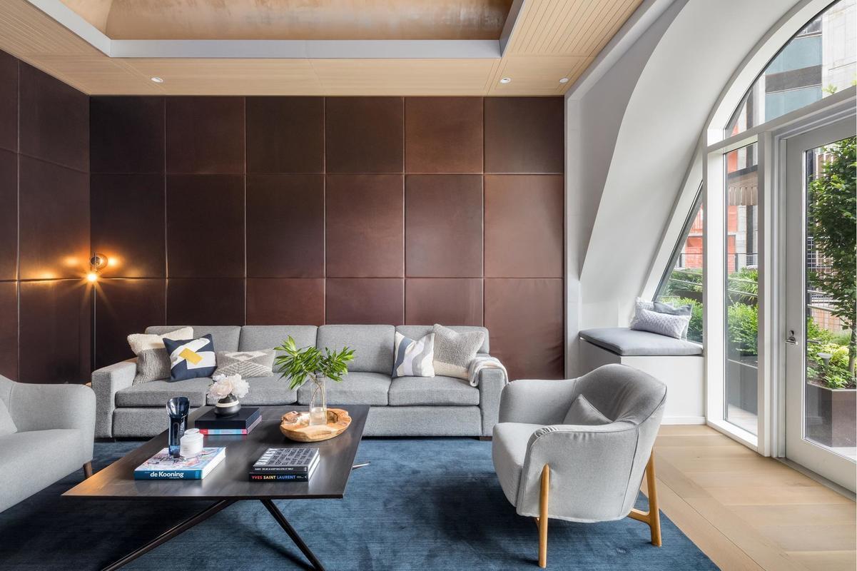 5 Beekman Street, Unit 21B Manhattan, NY 10038 - Photo 16 of 23 a living room with furniture and a potted plant