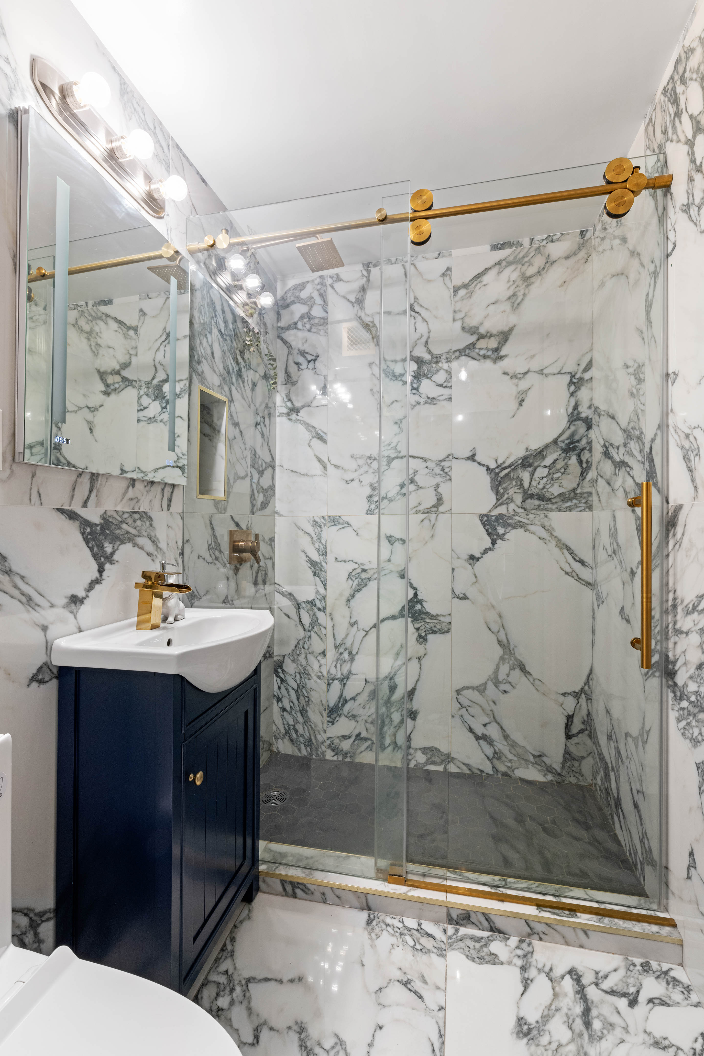 102-10 66th Road, Unit K25 Queens, NY 11375 - Photo 9 of 19 a bathroom with a sink and a mirror