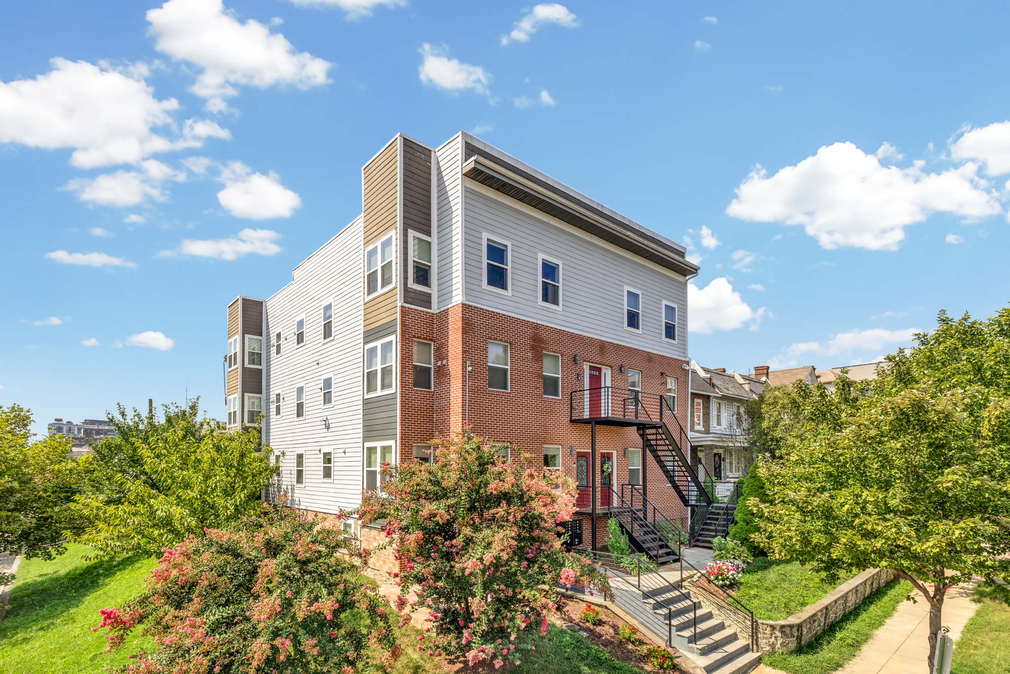 233 S Street Northeast, Unit 4 Washington, DC 20002 - Photo 2 of 37 a front view of a multi story residential apartment building with yard and parking space
