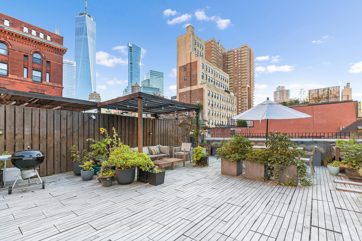 67 Hudson Street, Unit 4C Manhattan, NY 10013 - Photo 7 of 9 a view of a terrace with furniture and a potted plant