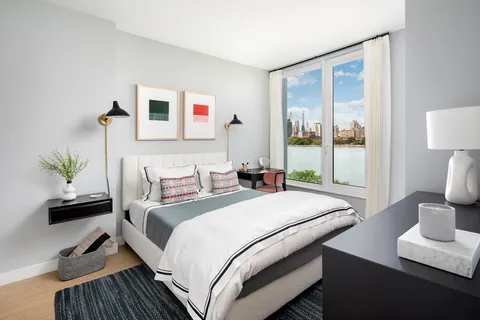 a bedroom with bed and a window