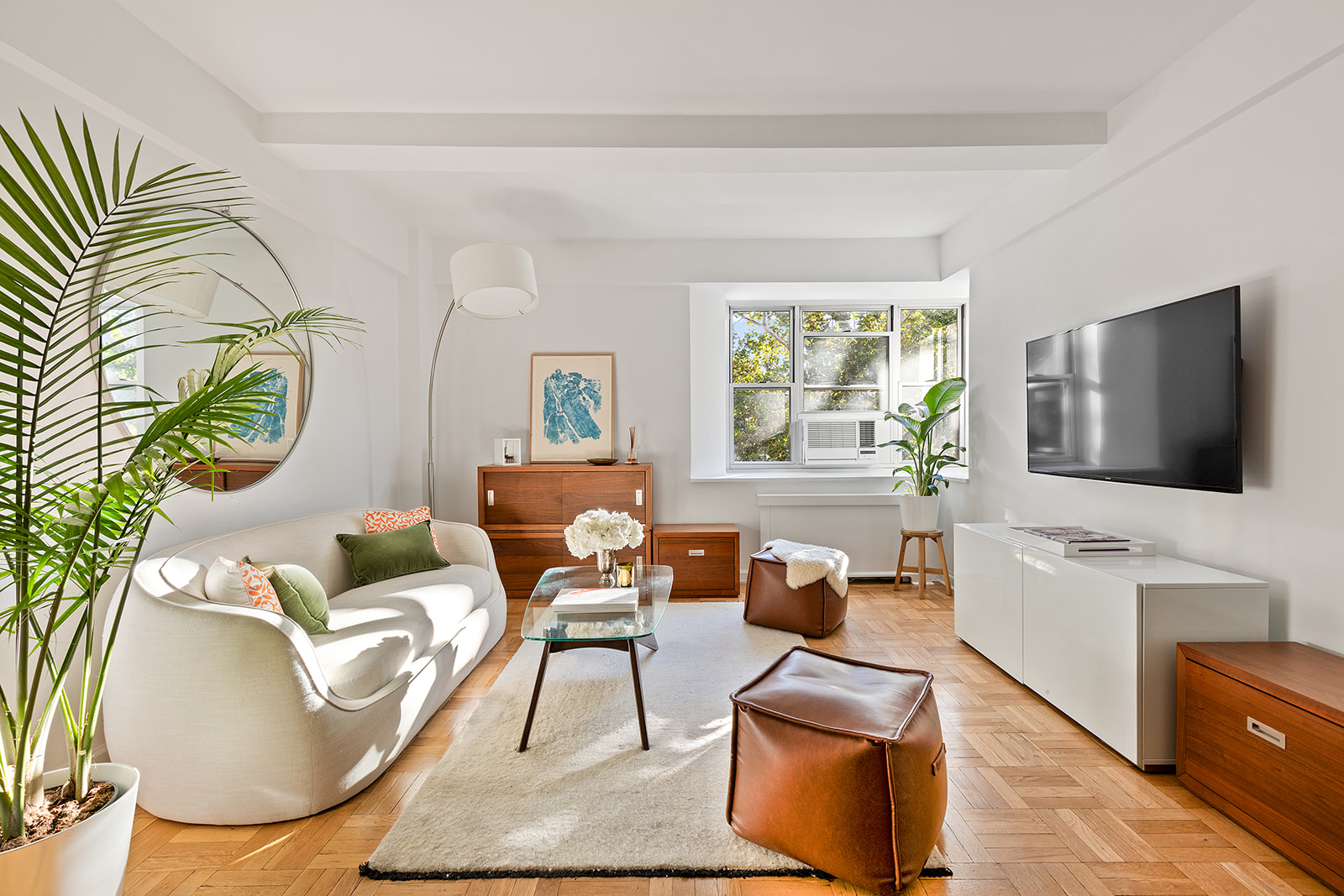 a living room with furniture and a flat screen tv