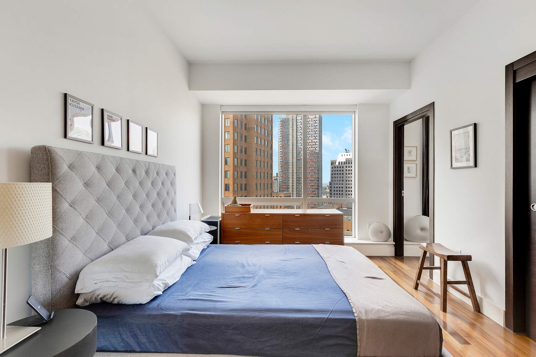 150 Myrtle Avenue, Unit 2503 Brooklyn, NY 11201 - Photo 9 of 28 a living room with furniture and a large window